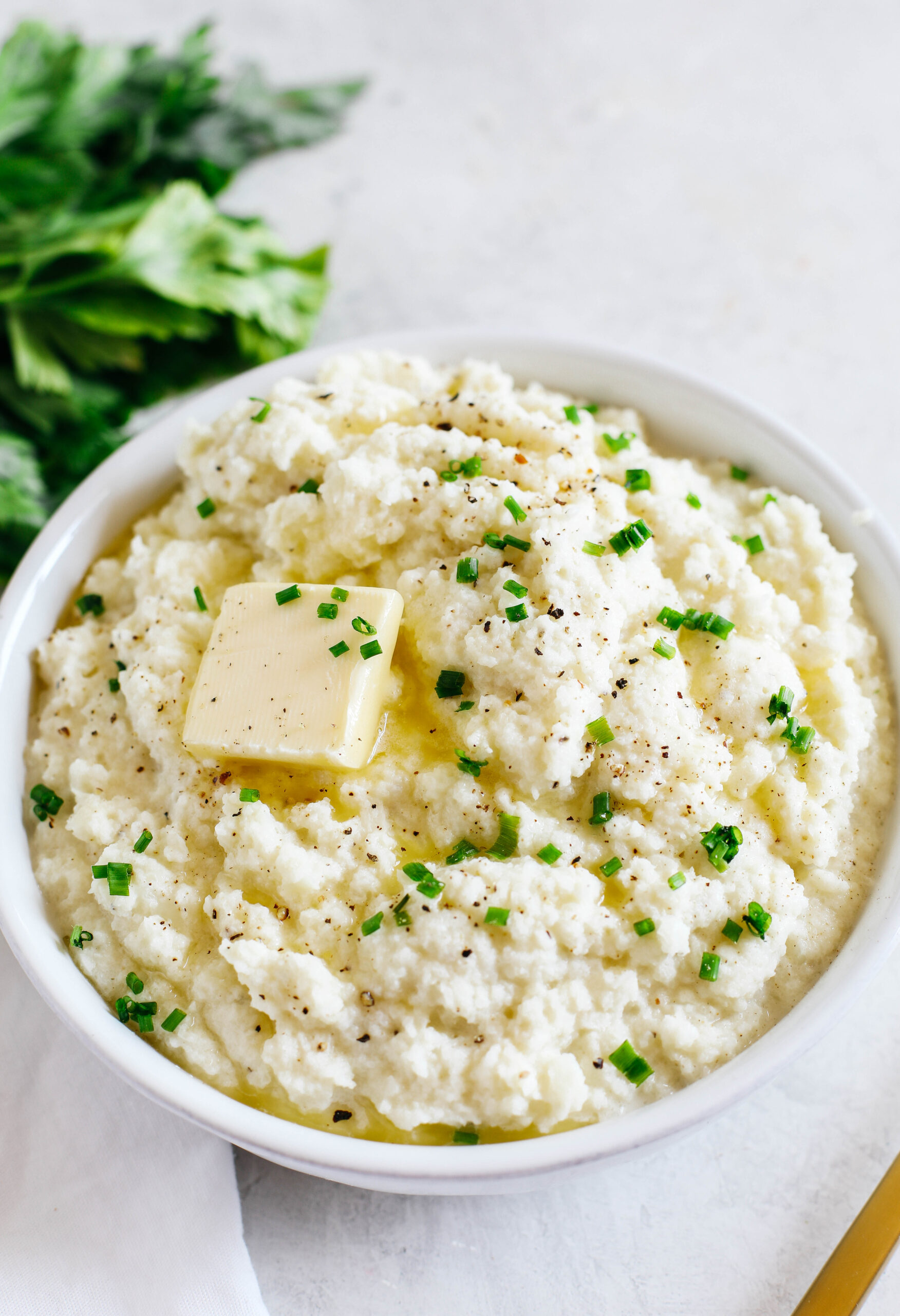 This EASY Mashed Cauliflower is creamy, delicious, and makes the perfect low carb, keto-friendly side dish easily made in under 15 minutes! #keto