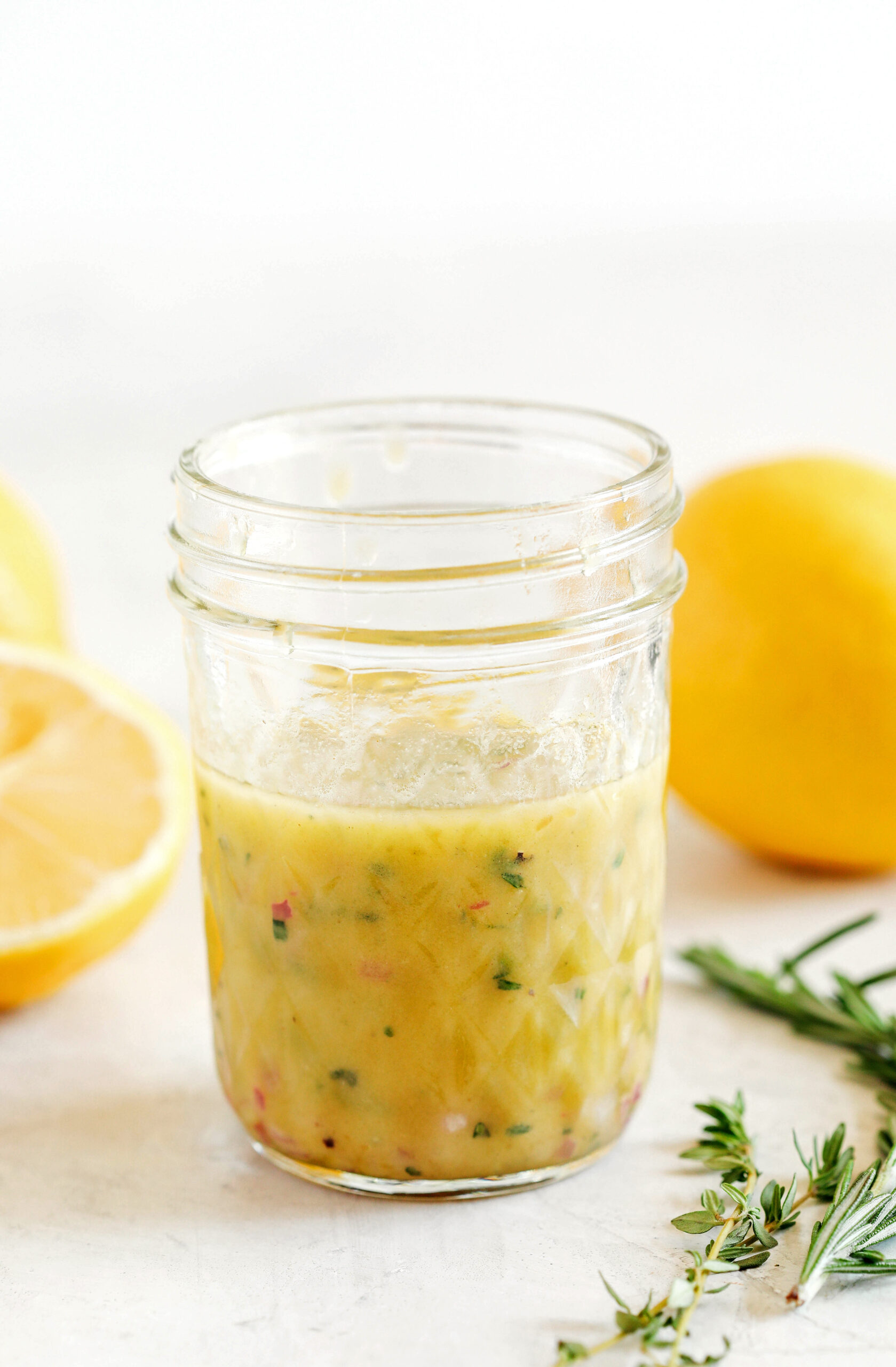 Bright and fresh Lemon Dijon Herb Dressing made in just minutes with a few simple pantry ingredients!  Perfect for salads, veggies, marinades, and more!