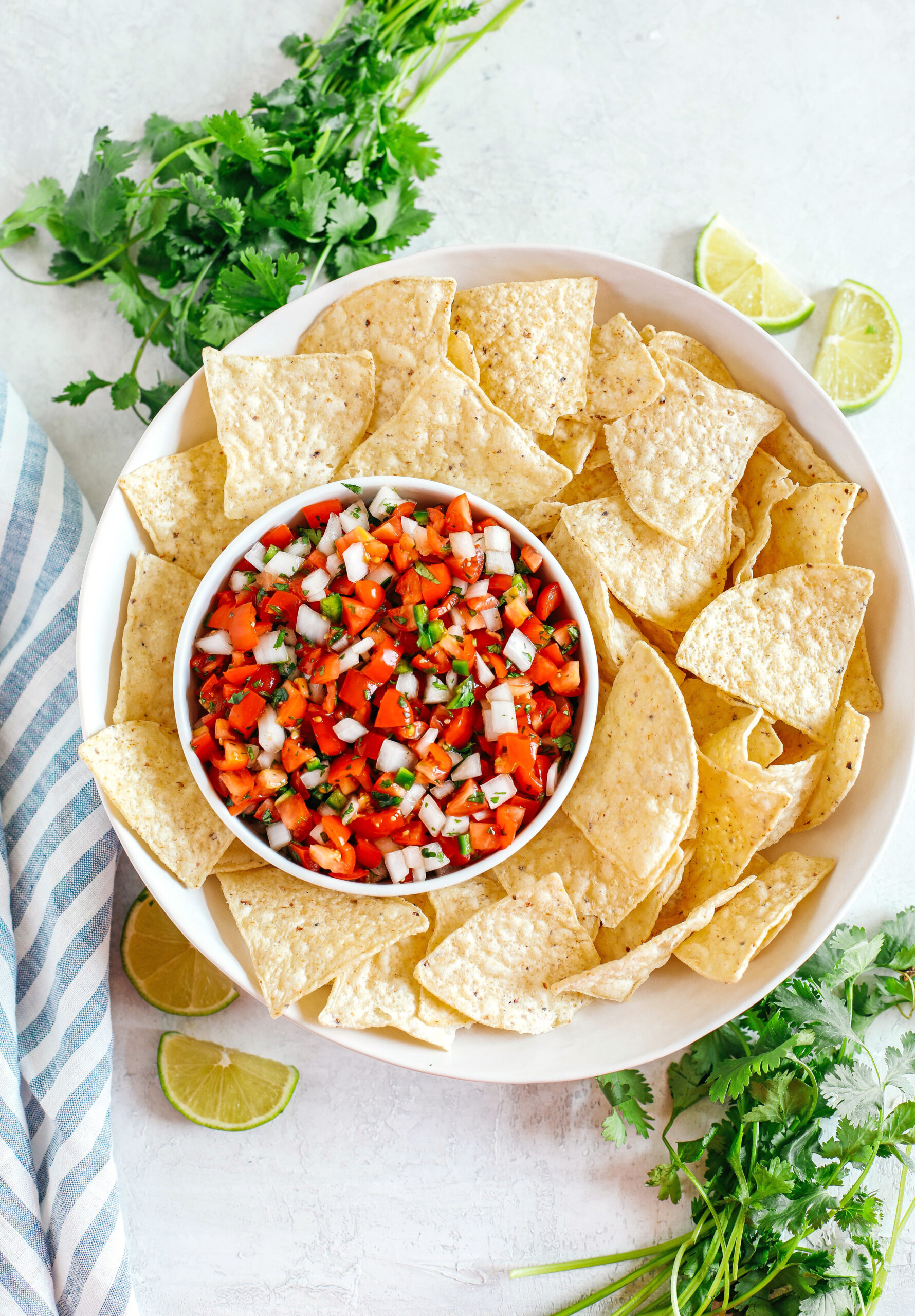 Fresh Homemade Pico De Gallo made with just a few simple ingredients for the perfect flavor boost to any healthy meal or serve as a delicious salsa with chips!