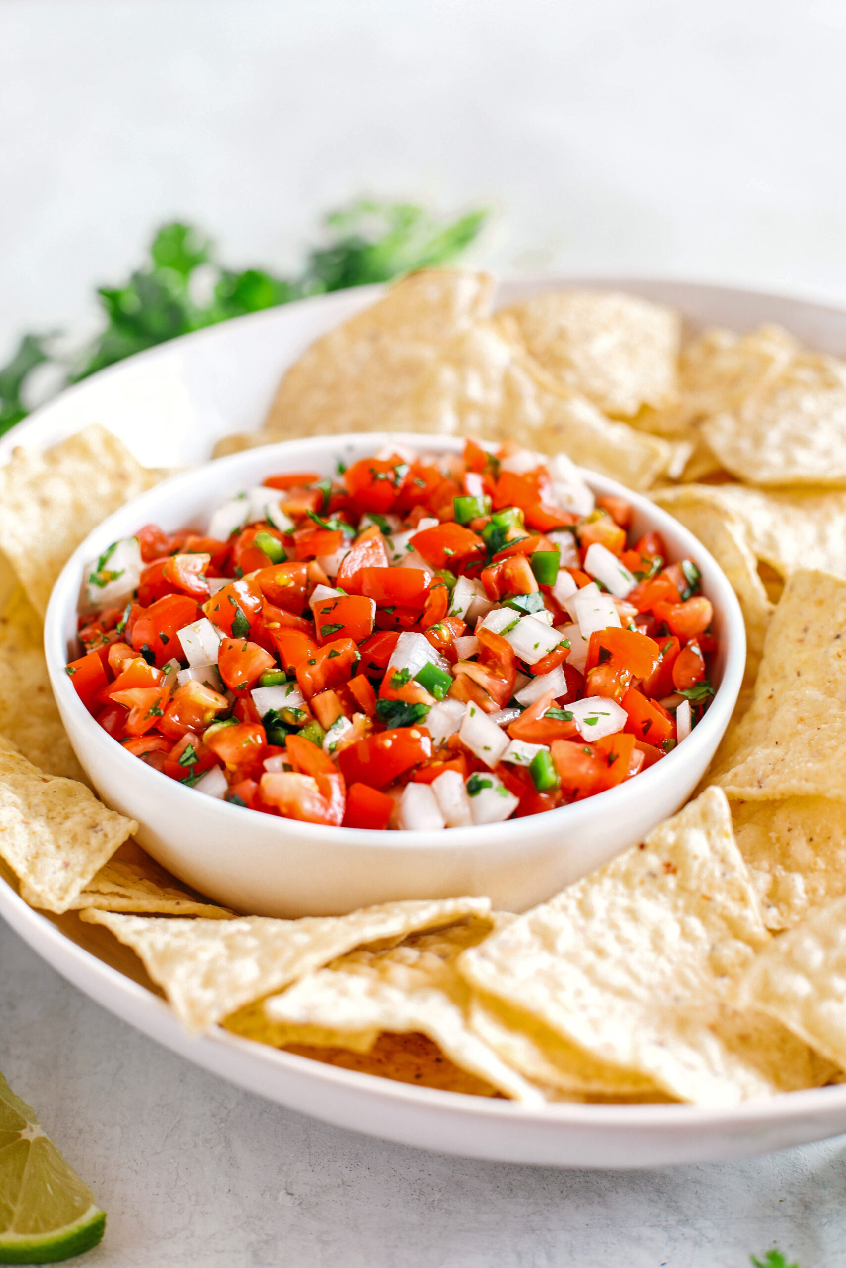 Fresh Homemade Pico De Gallo made with just a few simple ingredients for the perfect flavor boost to any healthy meal or serve as a delicious salsa with chips!