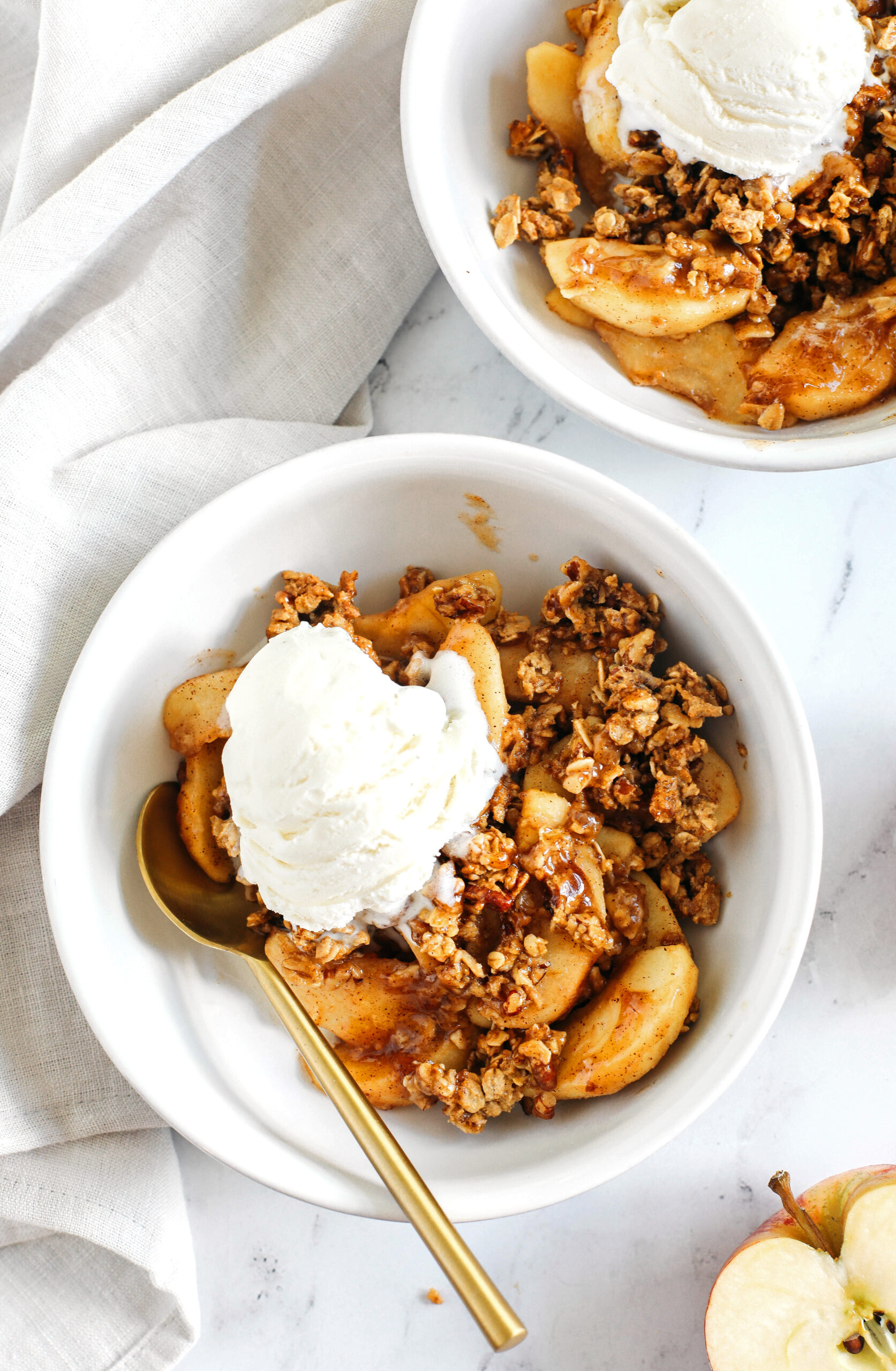 This Healthy Apple Crisp is loaded with tender apples and warm spices, naturally sweetened with maple syrup, all topped with a crunchy oatmeal pecan topping! 