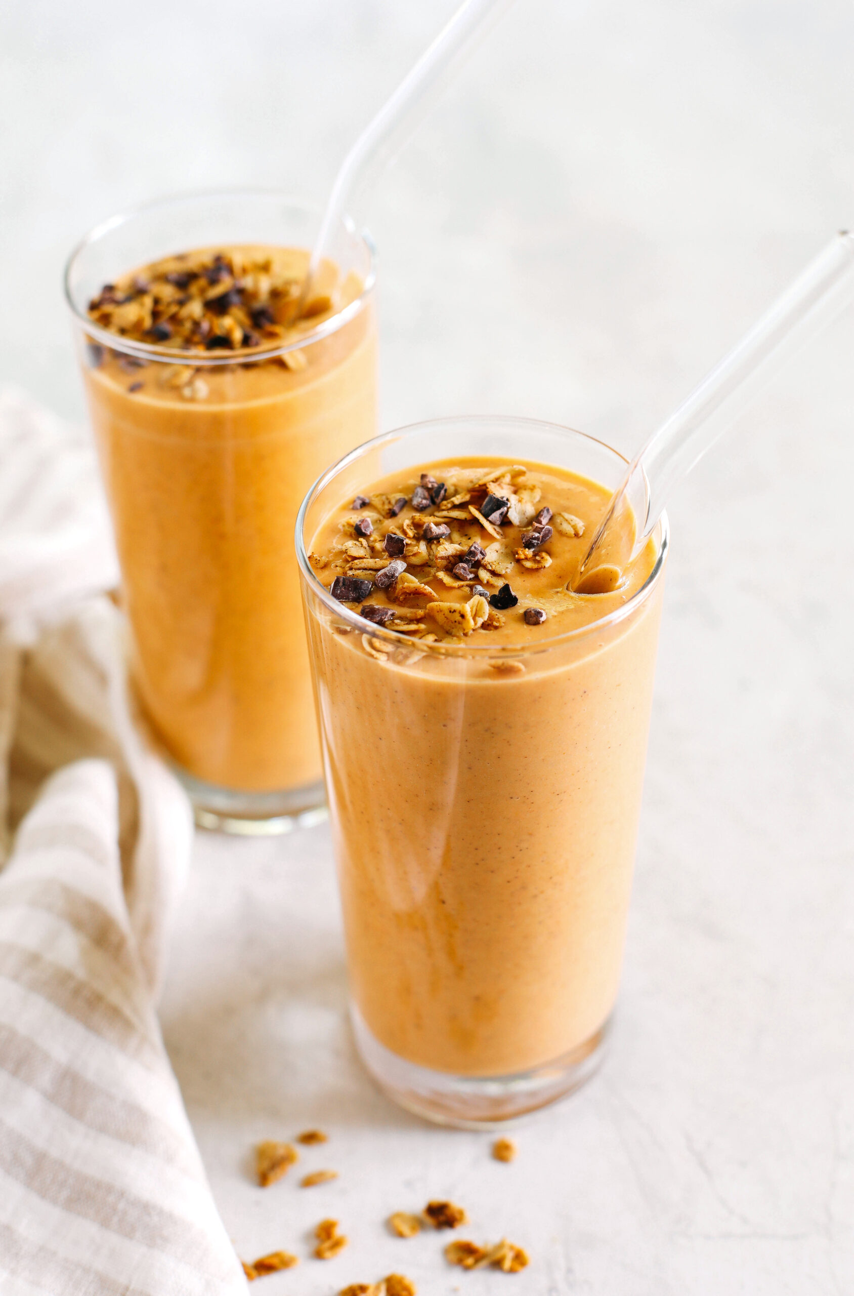 Start your morning off with this thick and creamy Pumpkin Spice Smoothie that is healthy, delicious and loaded with all your fall favorites like pumpkin, apple, banana, Greek yogurt, maple syrup and warm spices!