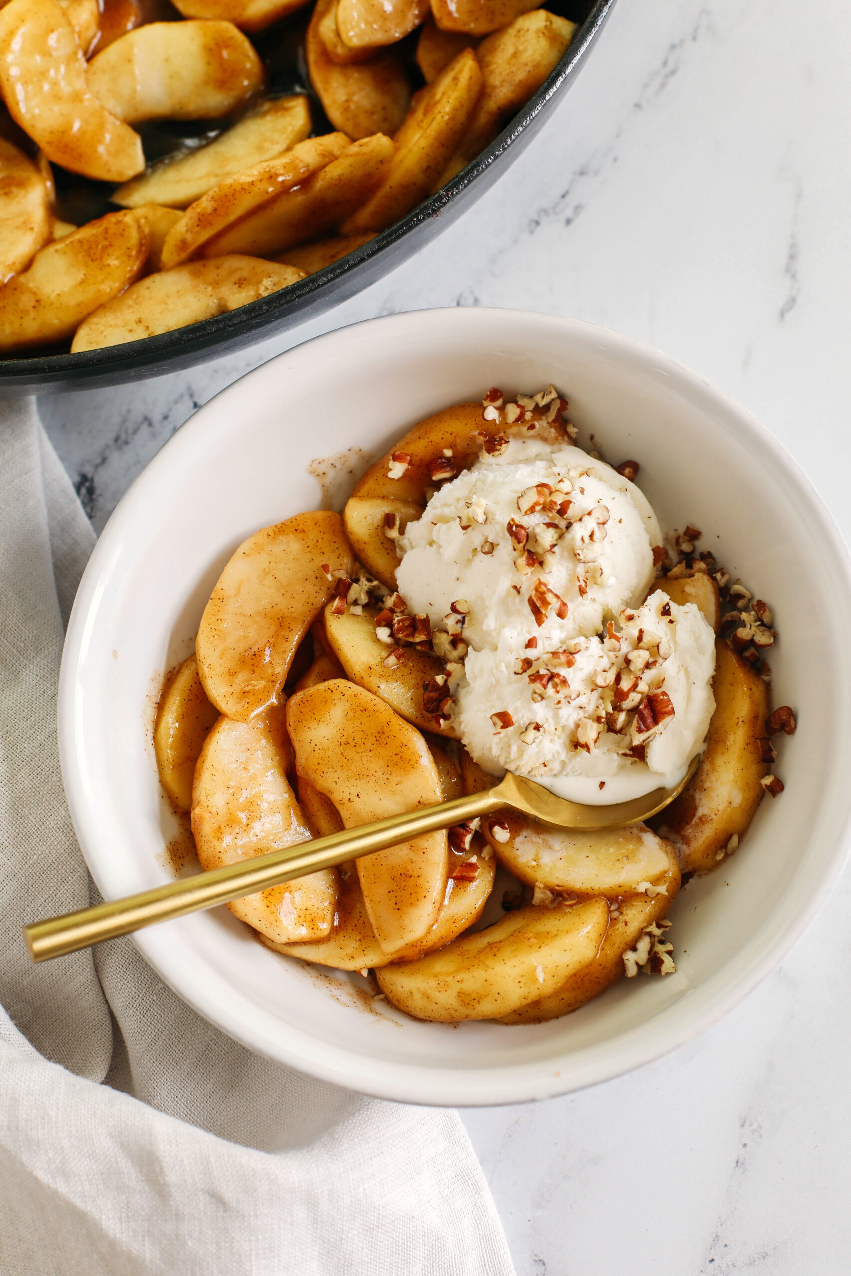 Quick and EASY Maple Cinnamon Sautéed Apples make the perfect dessert topped with ice cream, a delicious snack all on its own, or served with oatmeal, waffles, and pancakes!