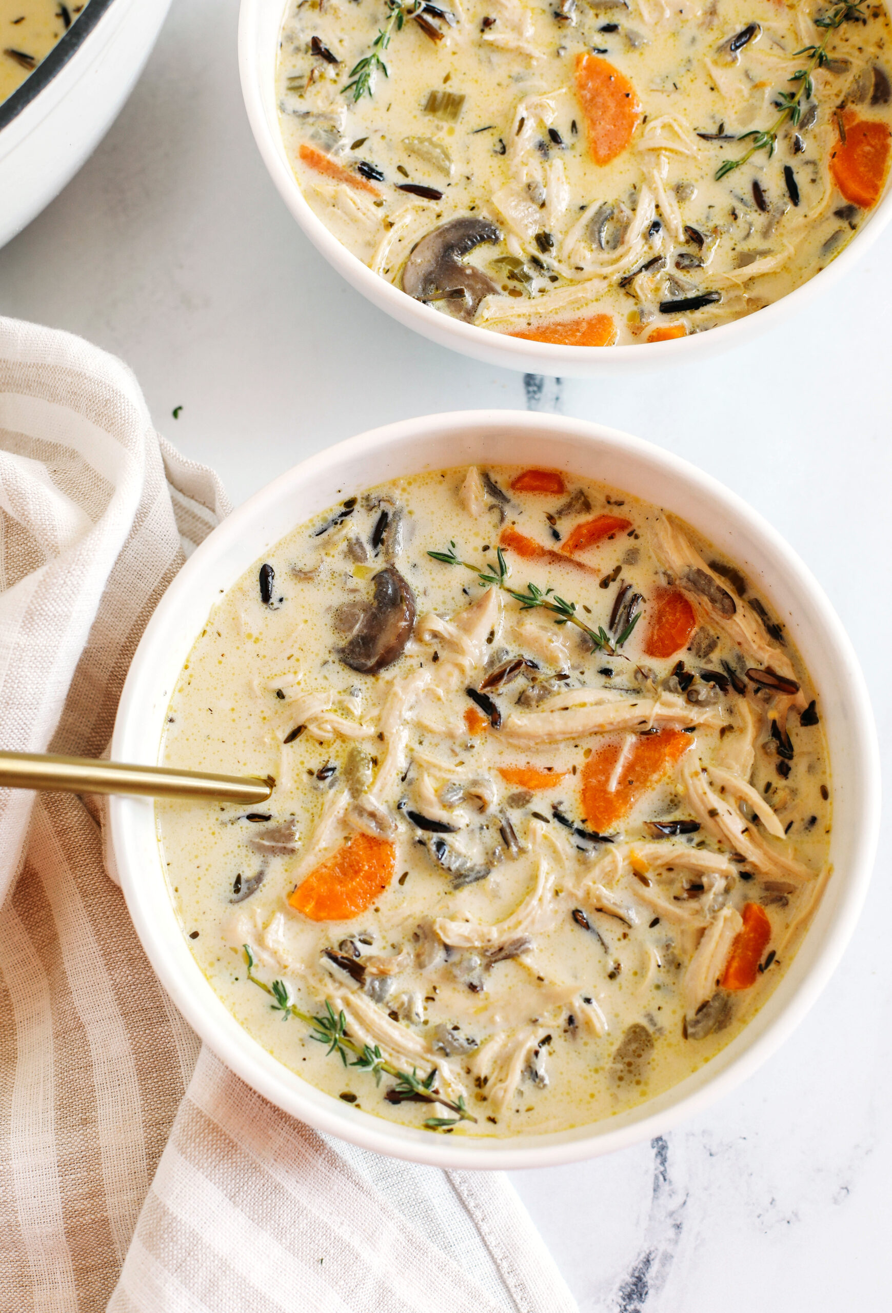 Creamy Chicken and Wild Rice Soup that is delicious, loaded with veggies and makes the perfect cozy meal that can easily made in your instant pot, slow cooker or right on the stove!
