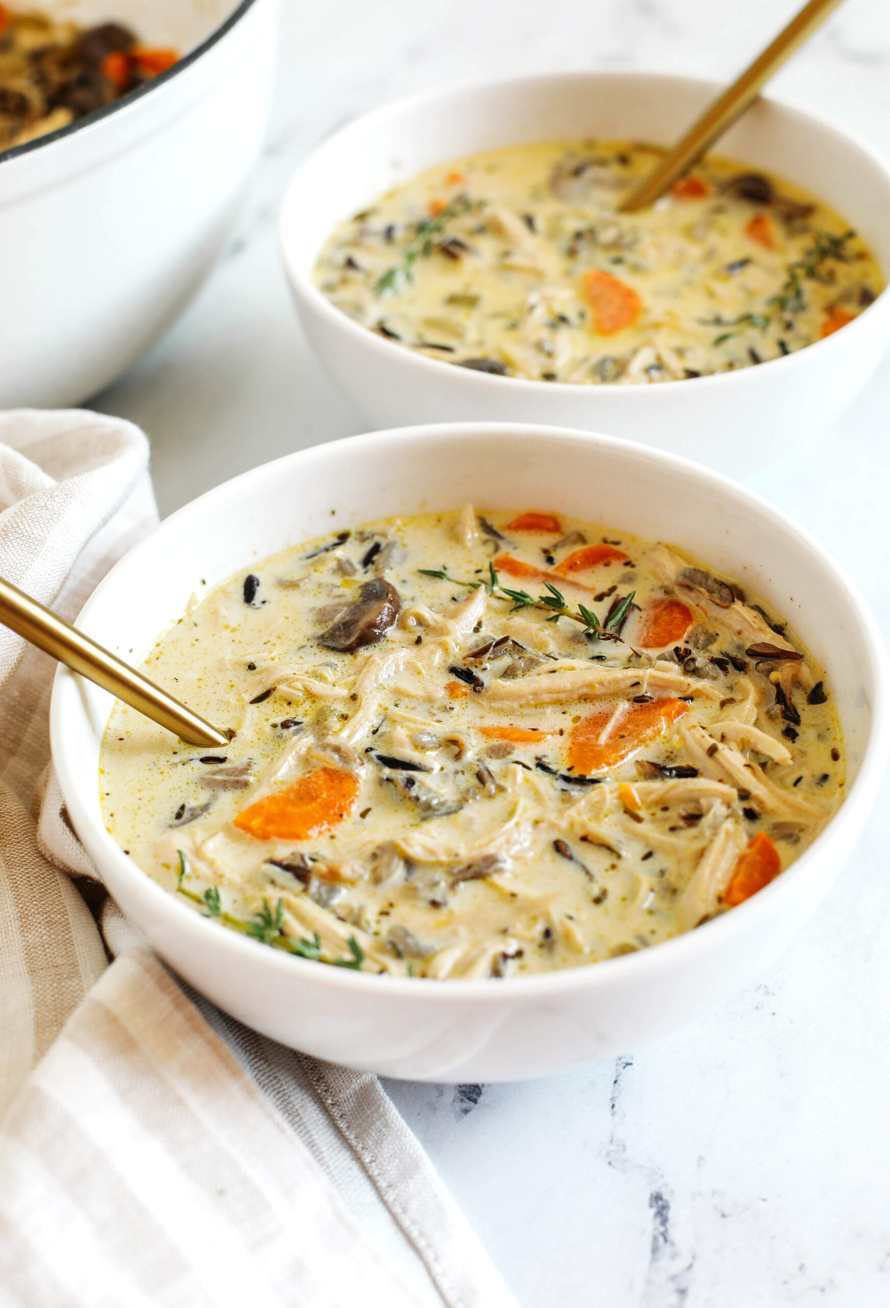 Creamy Chicken and Wild Rice Soup that is delicious, loaded with veggies and makes the perfect cozy meal that can easily made in your instant pot, slow cooker or right on the stove!