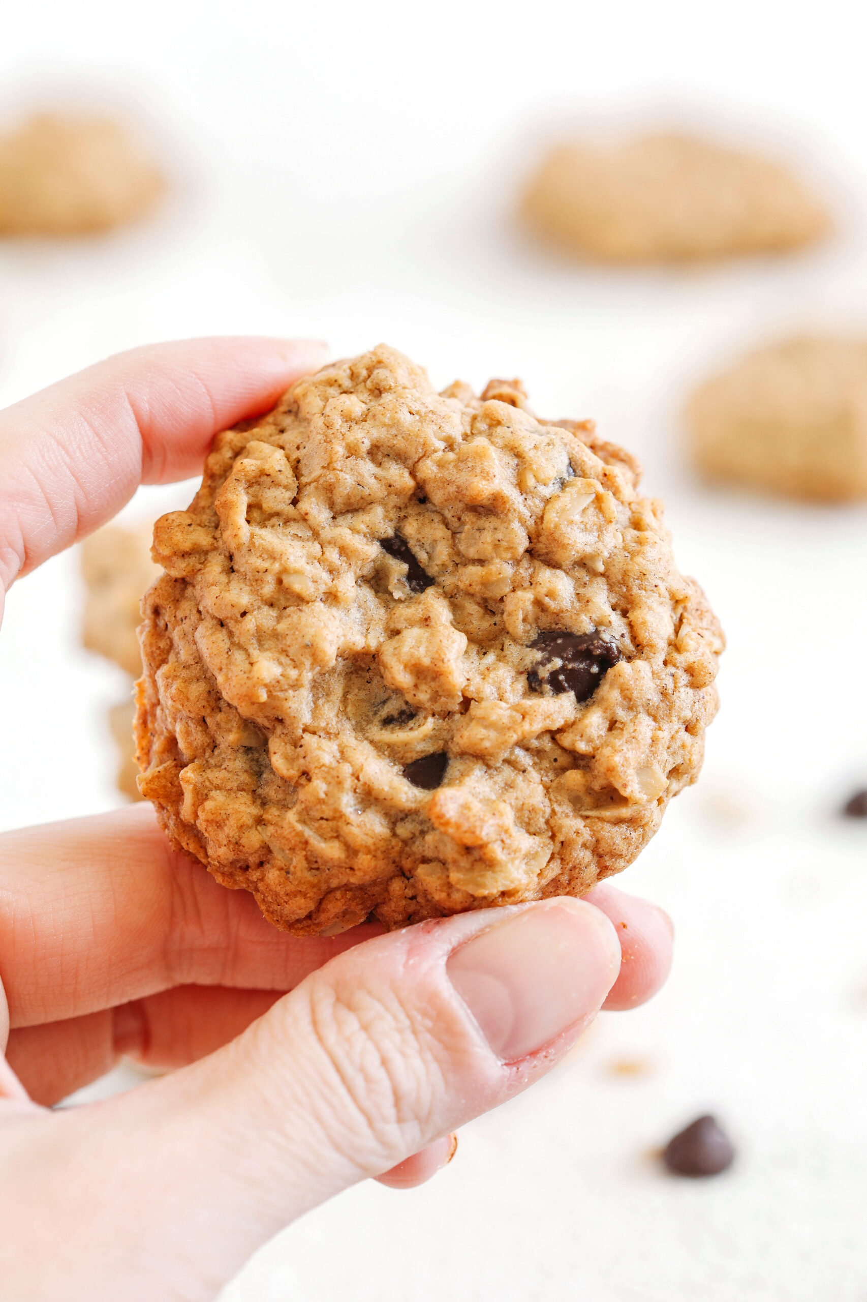 Soft and chewy Peanut Butter Oatmeal Cookies made healthier with wholesome ingredients, zero butter or refined sugar, and delicious chunks of chocolate in every bite! 