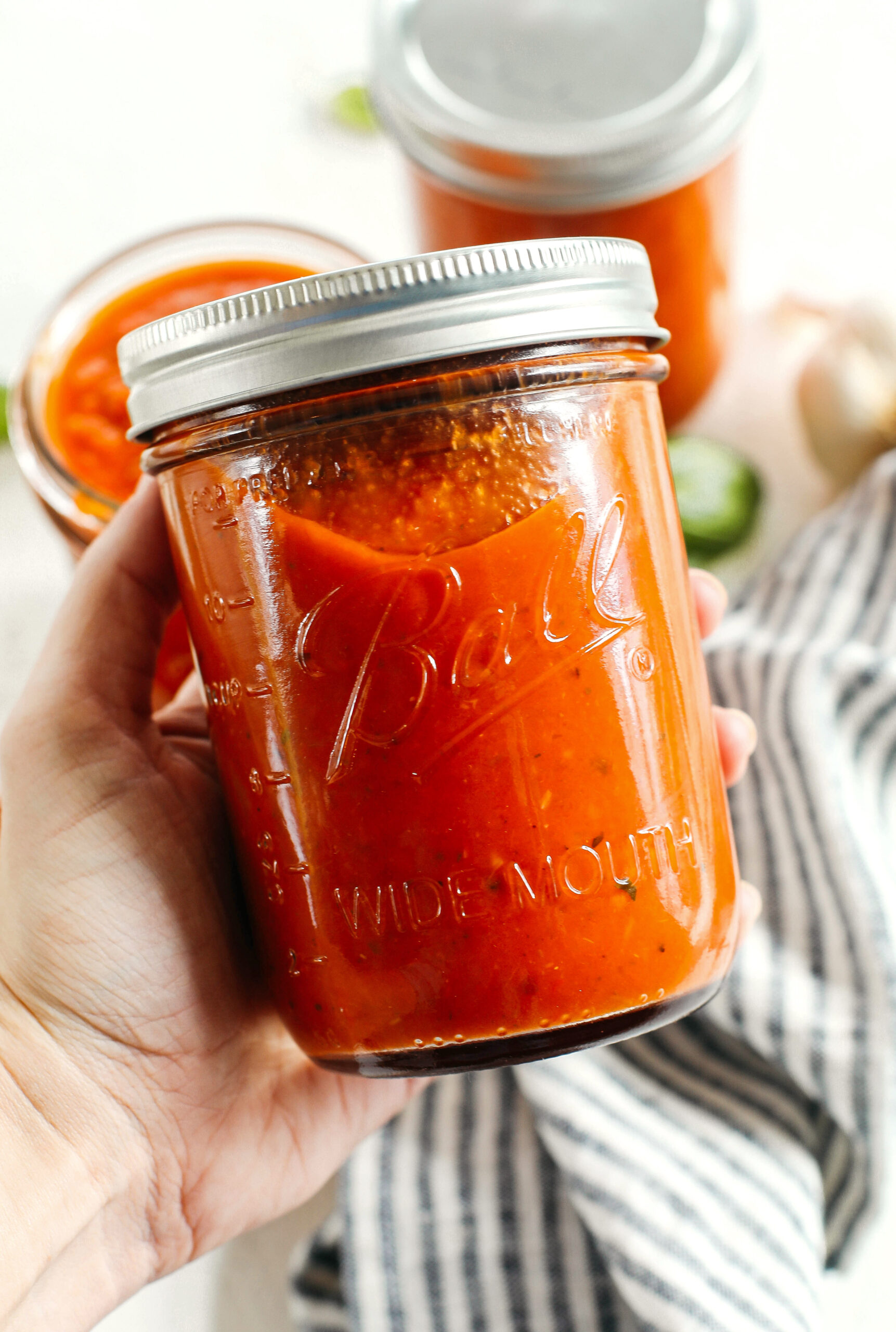 This Loaded Veggie Tomato Sauce is packed with zucchini, carrots, bell peppers, celery and onions all simmered and blended together for the most delicious marinara that can be used with pasta, meatballs, on top of pizza, as a dipping sauce and so much more!