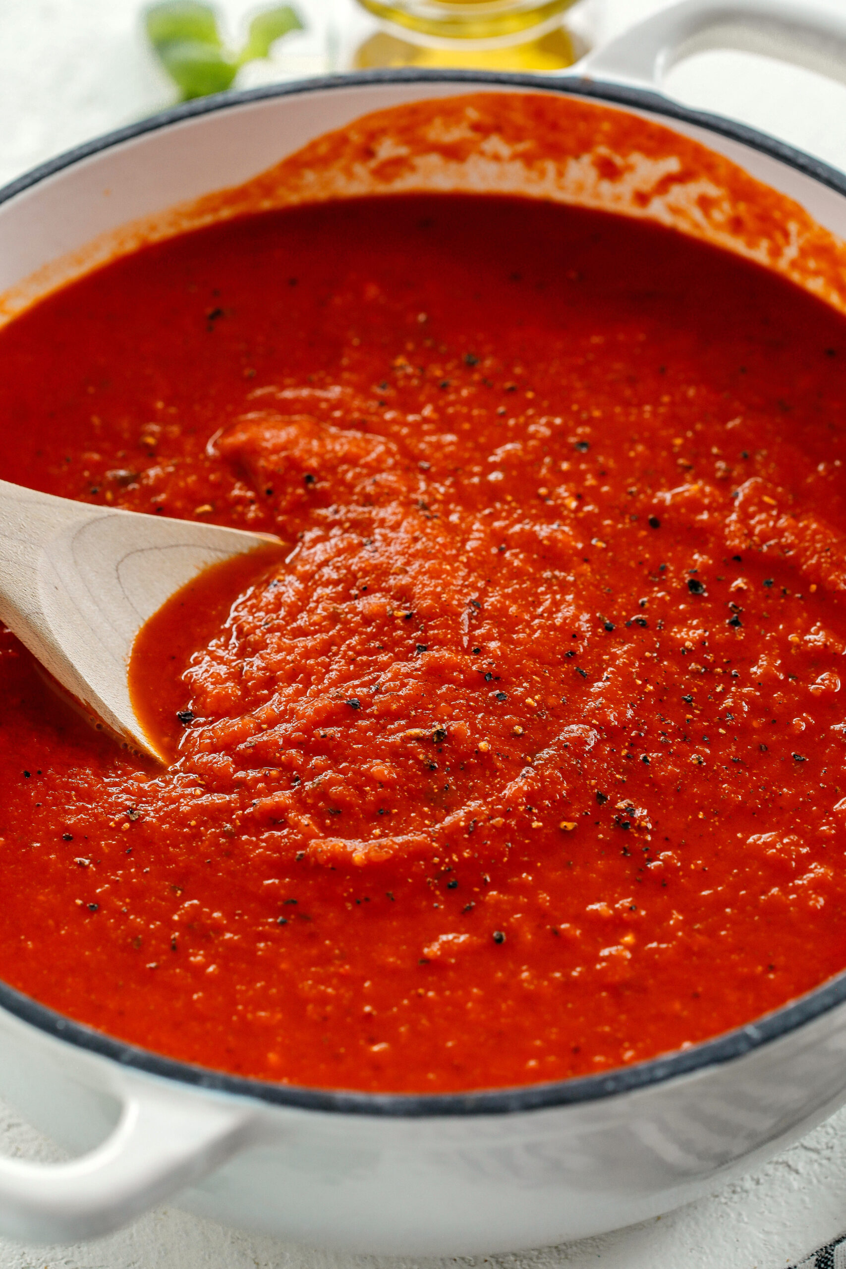 This Loaded Veggie Tomato Sauce is packed with zucchini, carrots, bell peppers, celery and onions all simmered and blended together for the most delicious marinara that can be used with pasta, meatballs, on top of pizza, as a dipping sauce and so much more!