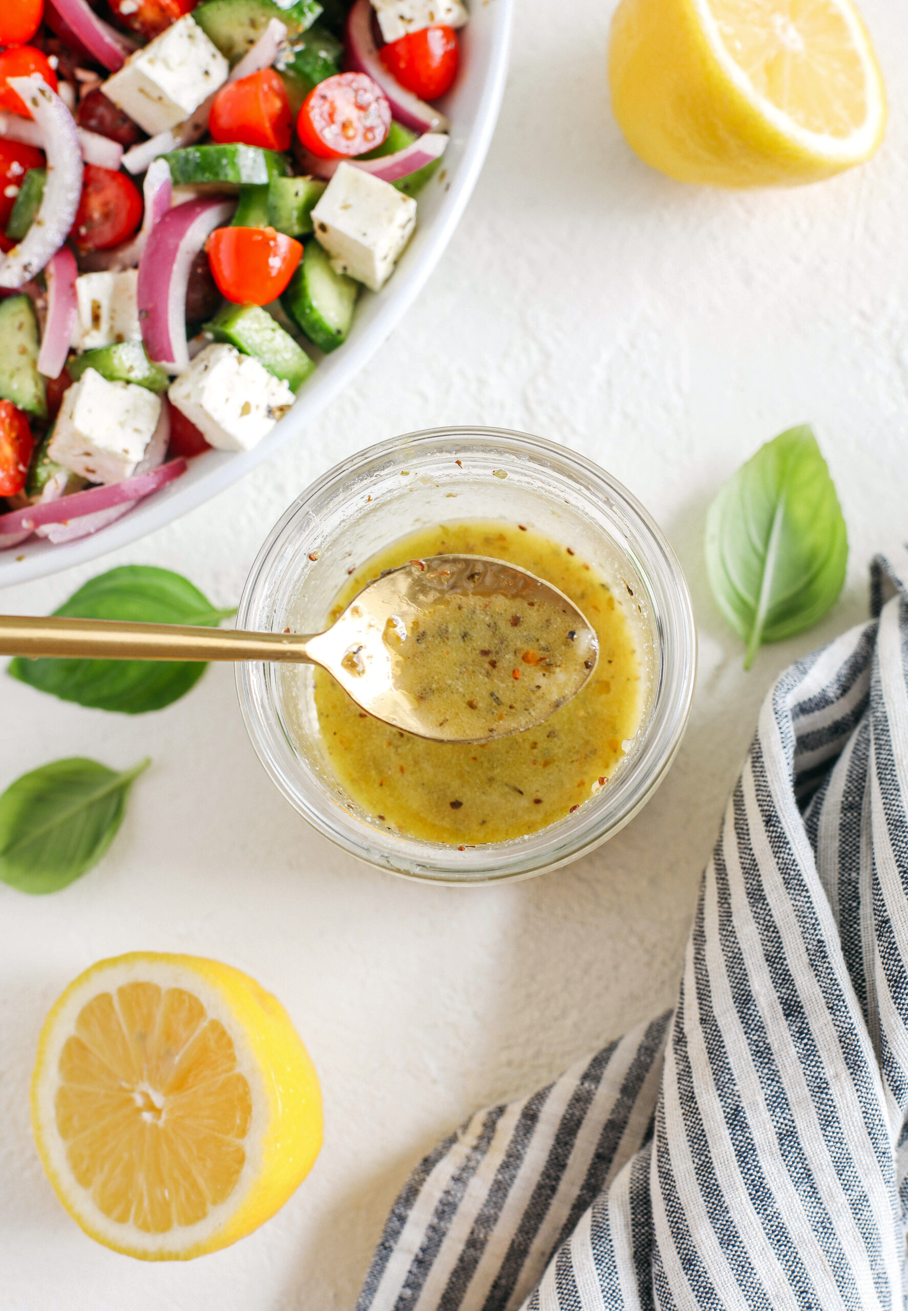 The most delicious homemade Greek Salad Dressing made with simple pantry ingredients perfect over salads, veggies, used as a marinade, pasta salads and more!