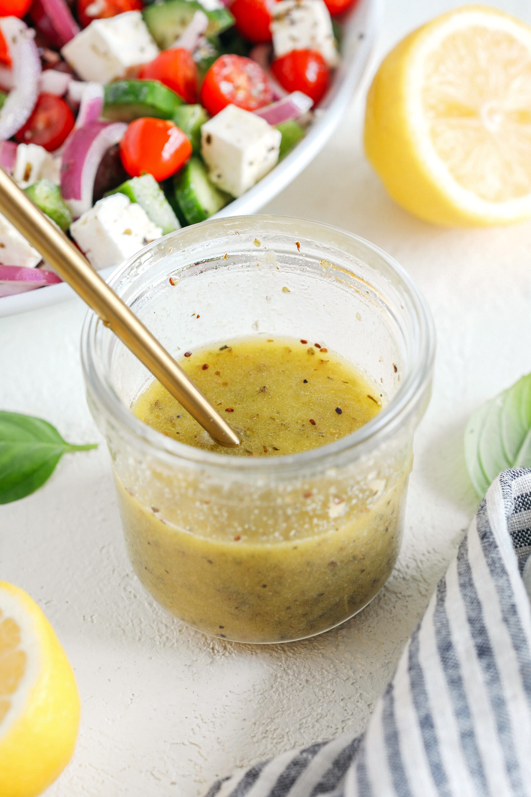 The most delicious homemade Greek Salad Dressing made with simple pantry ingredients perfect over salads, veggies, used as a marinade, pasta salads and more!