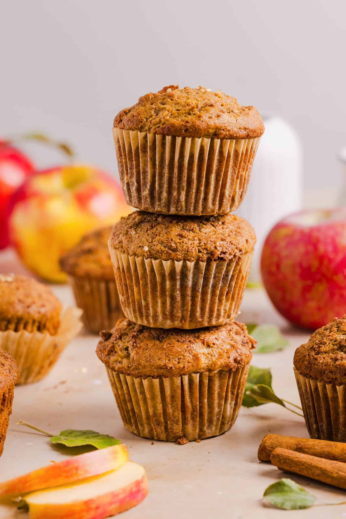 Healthy apple cinnamon muffins stacked on top of each other