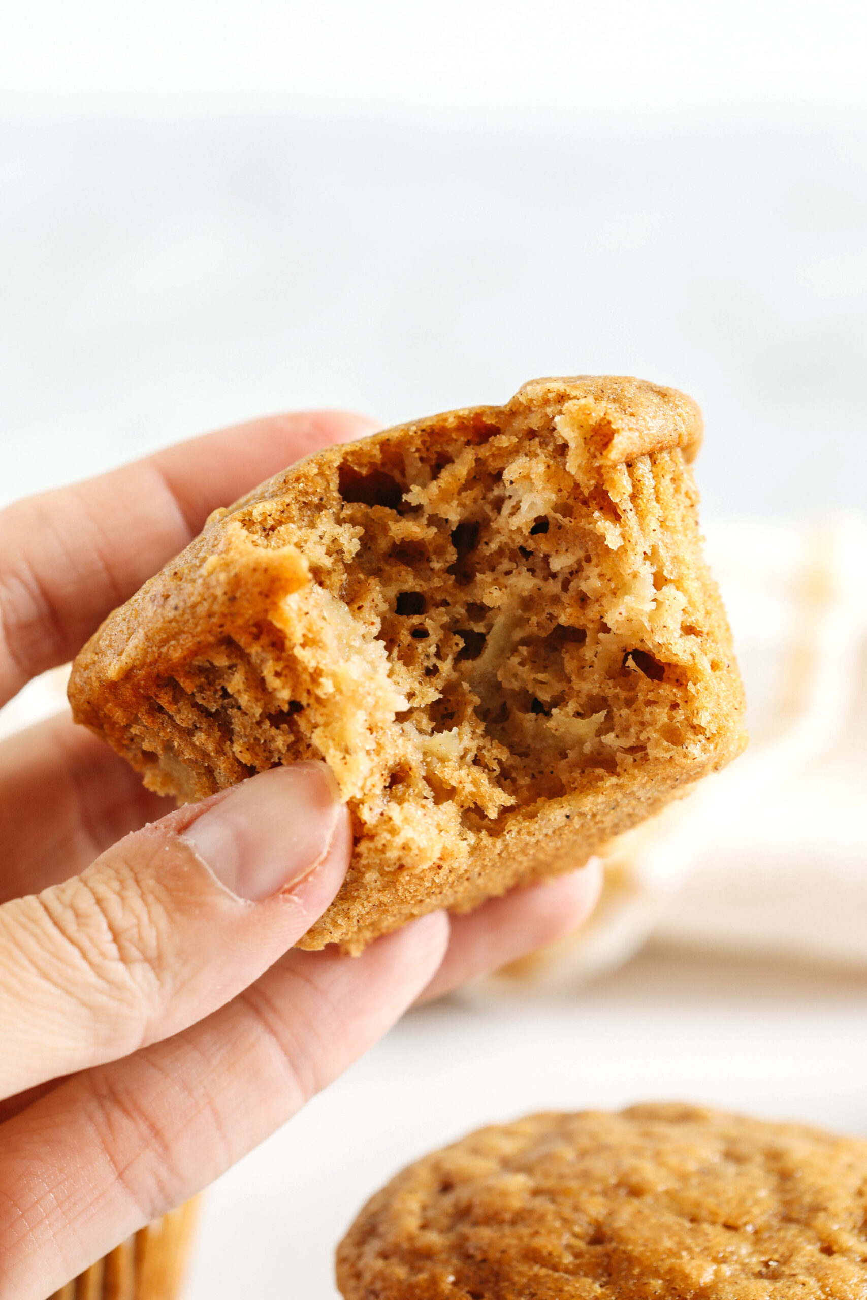 These Healthy Apple Cinnamon Muffins are moist, fluffy, and made healthier with whole wheat flour, Greek yogurt, and zero butter or refined sugar!  Loaded with delicious chunks of apple and warm spices for the perfect fall muffin!
