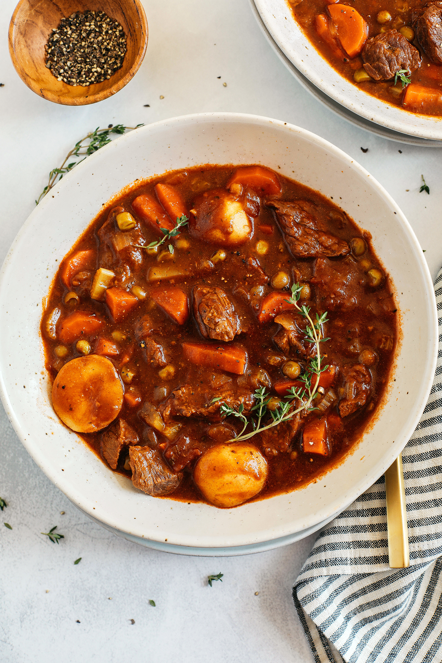This classic hearty Beef and Tomato Stew is loaded with tender beef, melt in your mouth potatoes, veggies and fresh herbs!  Perfect cozy recipe for a chilly weekend at home and can easily be made in your instant pot, slow cooker or even right on the stove!
