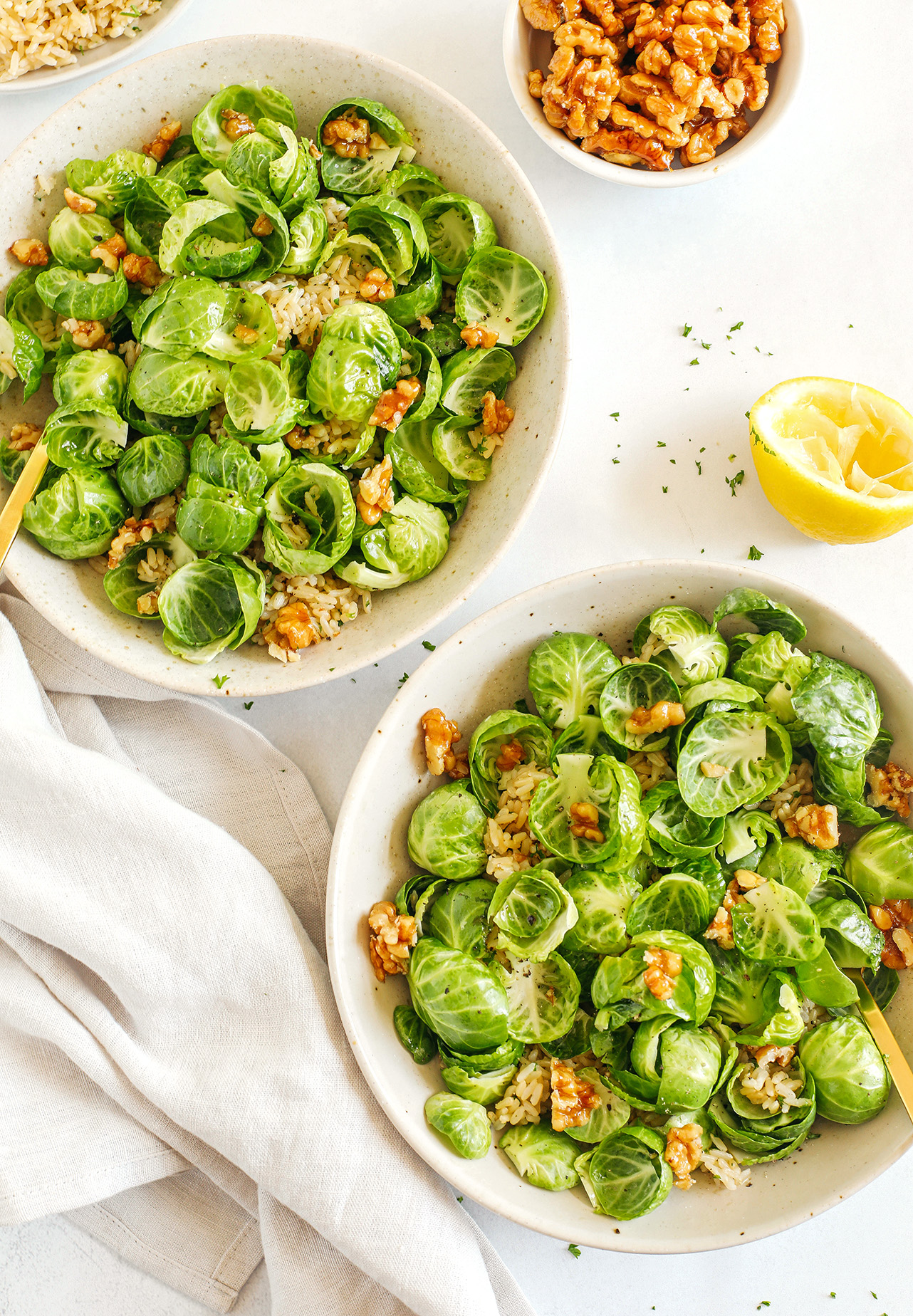 Easy and flavorful sautéed Brussels Sprout and Brown Rice Salad that makes the perfect side dish loaded with garlic, bright lemon flavor and crunchy walnuts! 