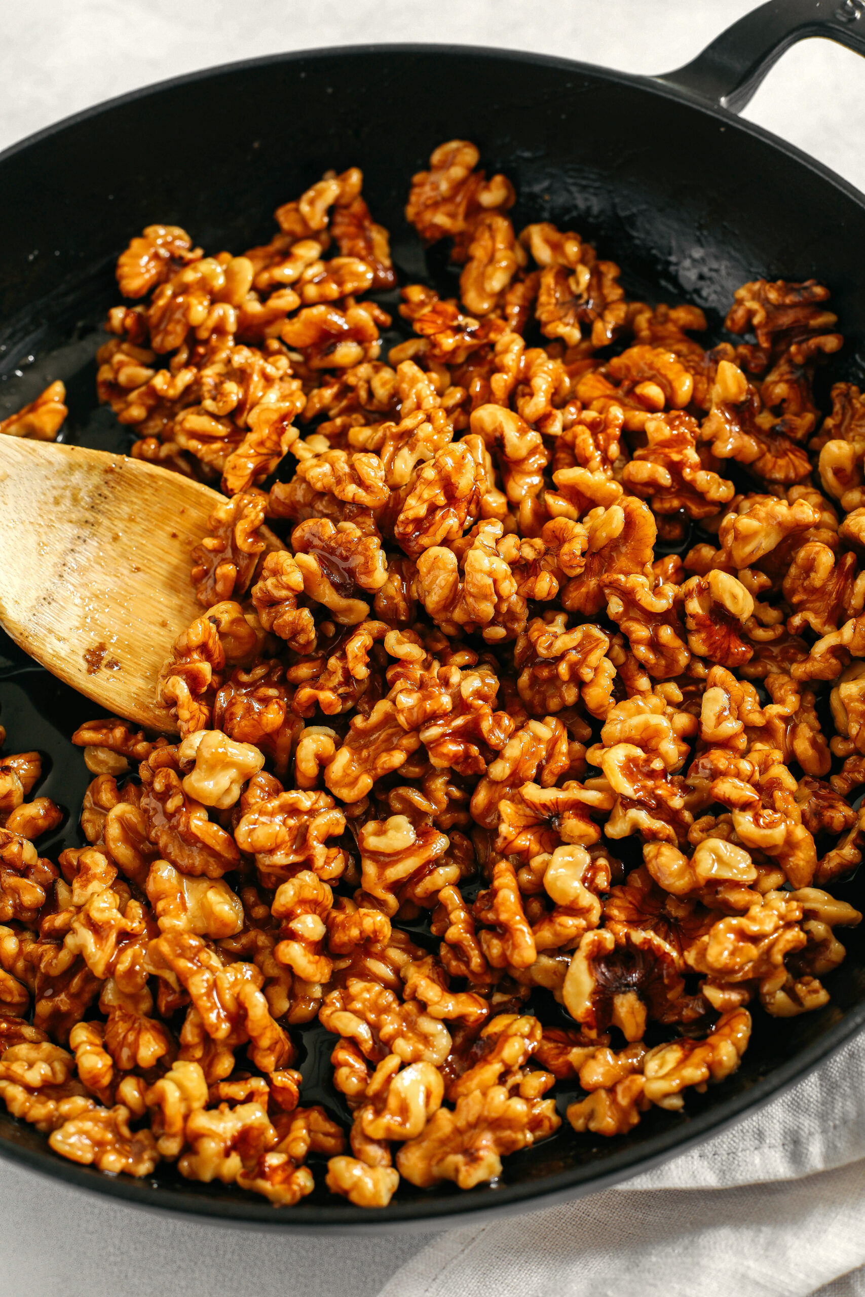 Sweet and crunchy Candied Maple Walnuts easily made in under 10 minutes with only 4 simple ingredients and naturally sweetened with maple syrup, vanilla and cinnamon!  The perfect addition to salads, cheeseboards, desserts or enjoy as a delicious snack!