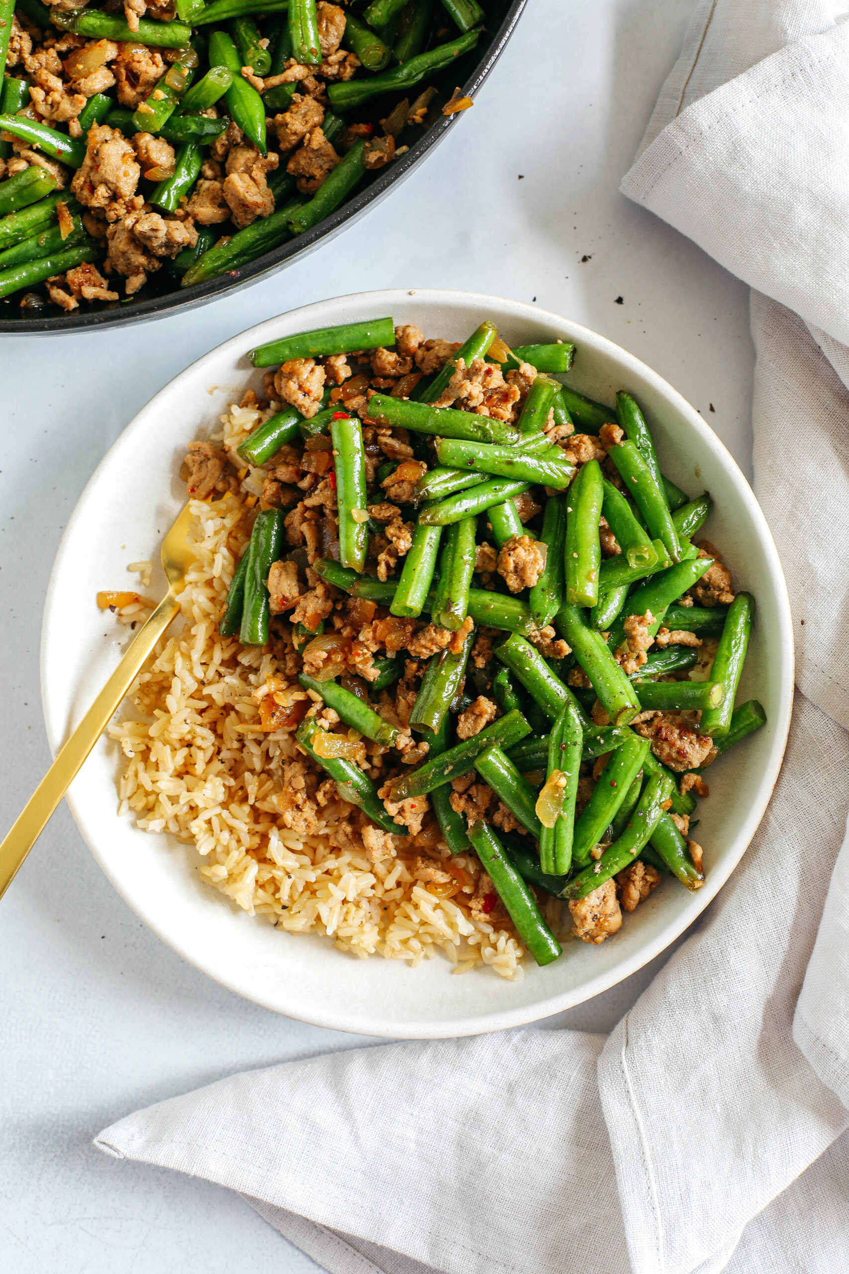 Quick and flavorful Ground Turkey and Green Bean Stir Fry easily made in under 20 minutes all in one pan!  Lean ground turkey with crisp green beans all tossed together in the most delicious Asian-inspired sauce that's better than take-out!