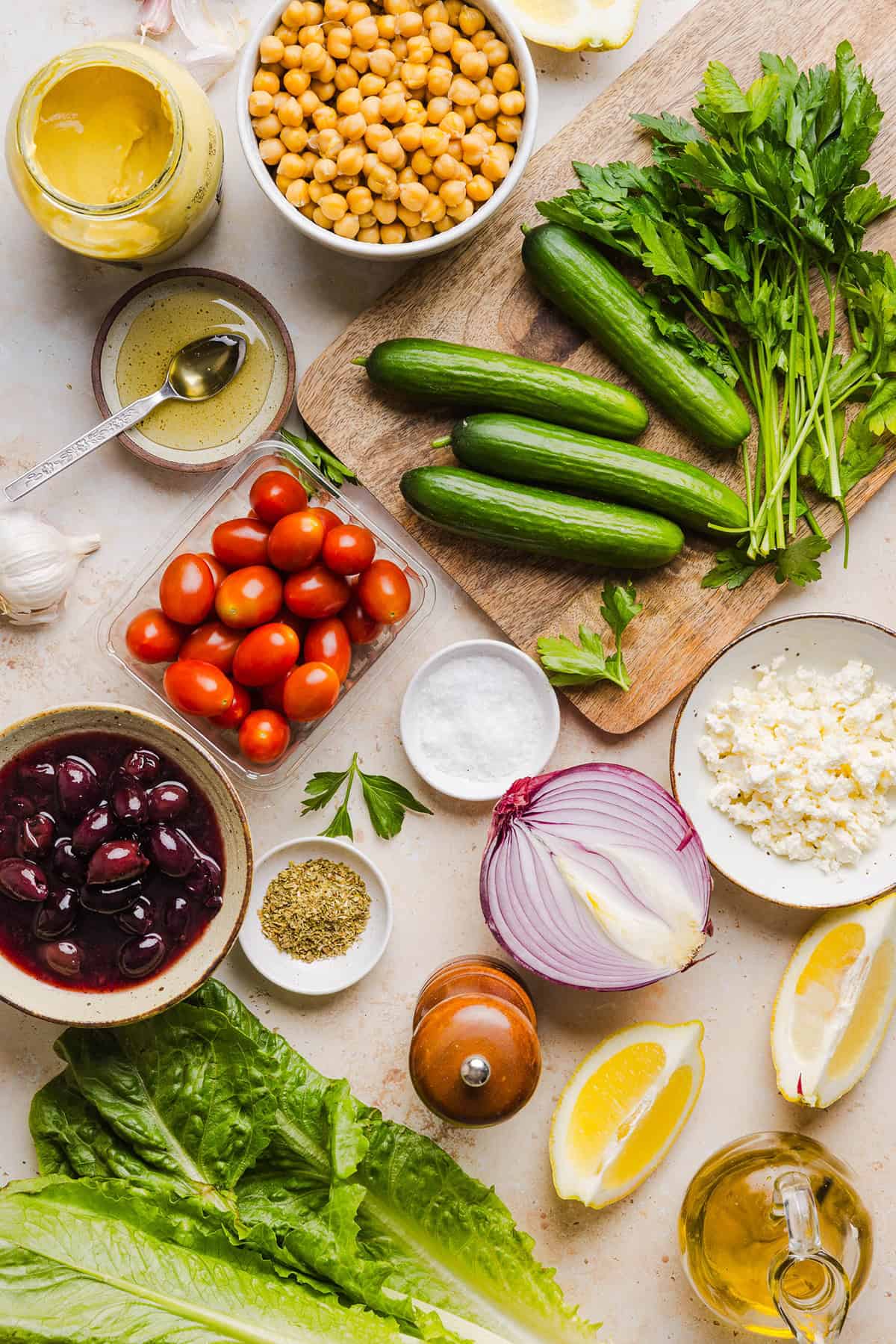 Fresh and crisp Mediterranean Chopped Salad made with fresh tomatoes, crisp cucumbers, red onion, chickpeas, olives and feta cheese all tossed with a delicious red wine vinaigrette! Perfect for meal prep, lunches, or an easy side dish for any meal.