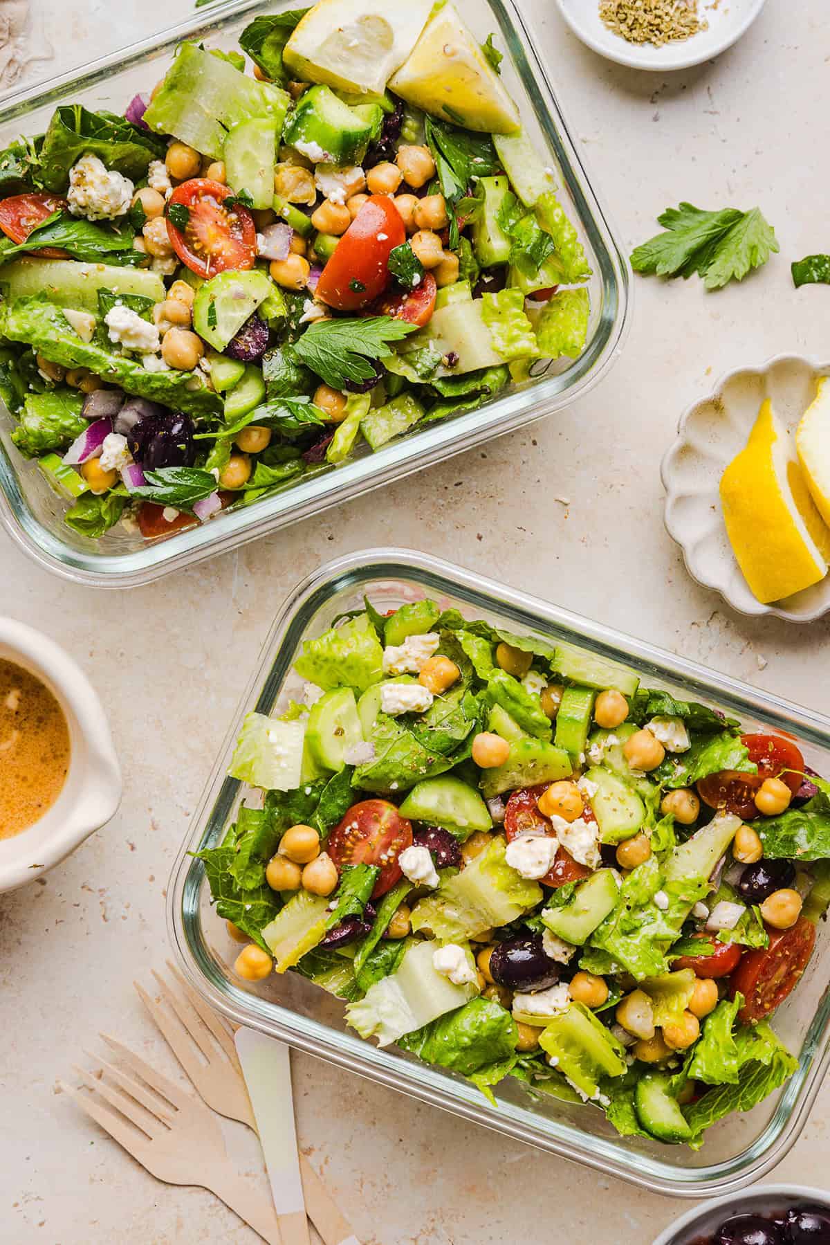 Fresh and crisp Mediterranean Chopped Salad made with fresh tomatoes, crisp cucumbers, red onion, chickpeas, olives and feta cheese all tossed with a delicious red wine vinaigrette! Perfect for meal prep, lunches, or an easy side dish for any meal.