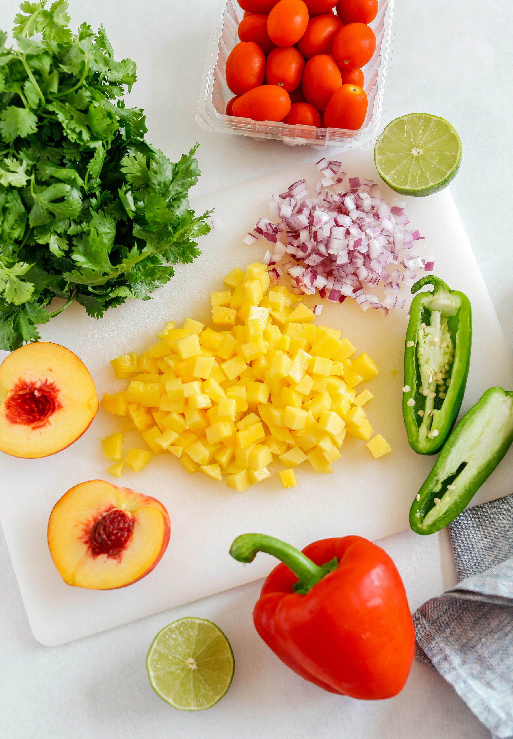 Fresh Peach Mango Salsa easily made in just minutes with only few simple ingredients that makes the perfect topping for tacos, grilled chicken or fish and makes a delicious appetizer served with tortilla chips!