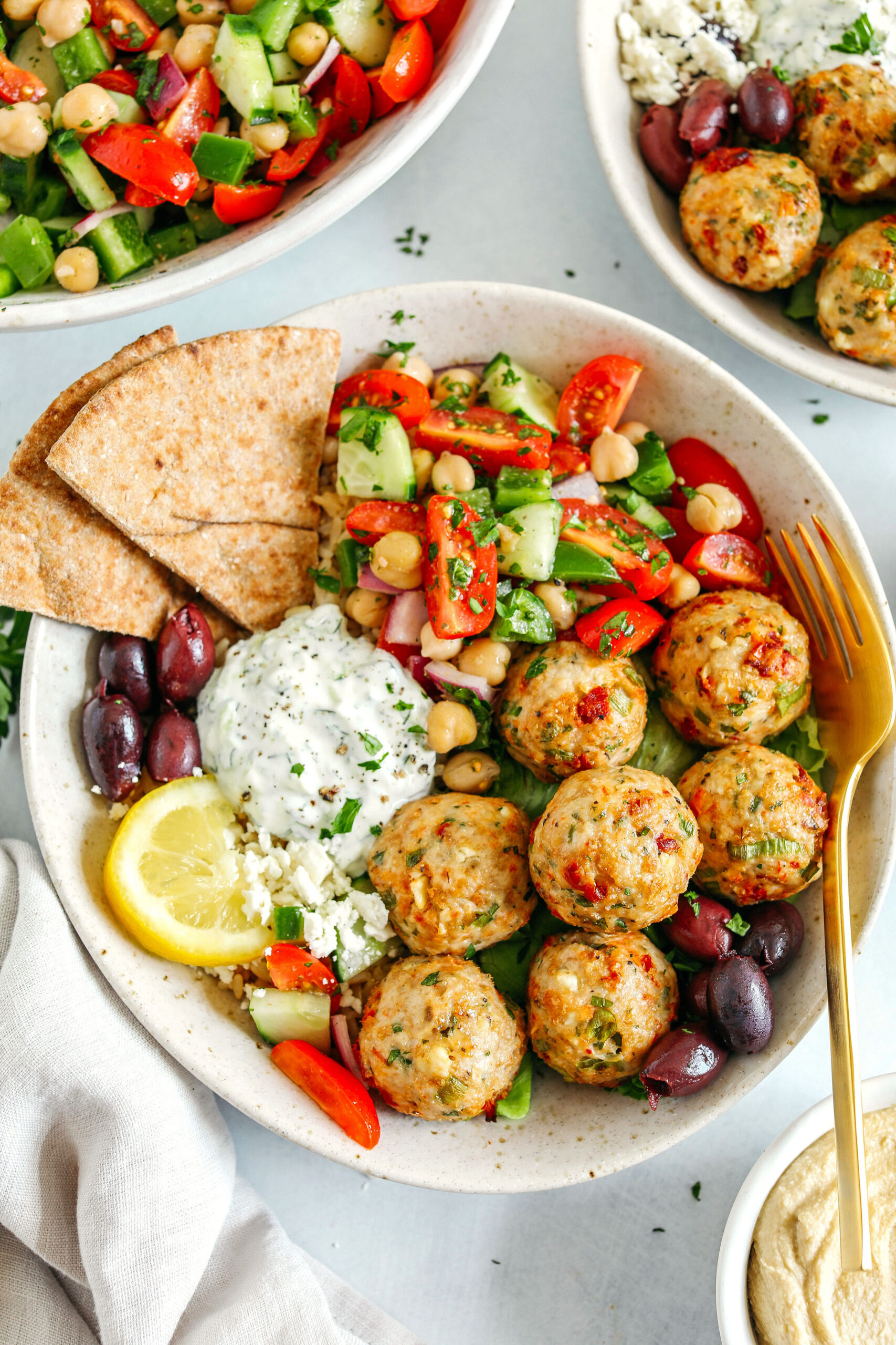 The most delicious Mediterranean Chicken Meatballs packed with flavor and easily made in under 30 minutes!  Serve with brown rice, homemade tzatziki sauce, sprinkle on some feta cheese, or pair with a tomato and chickpea salad for a complete meal!