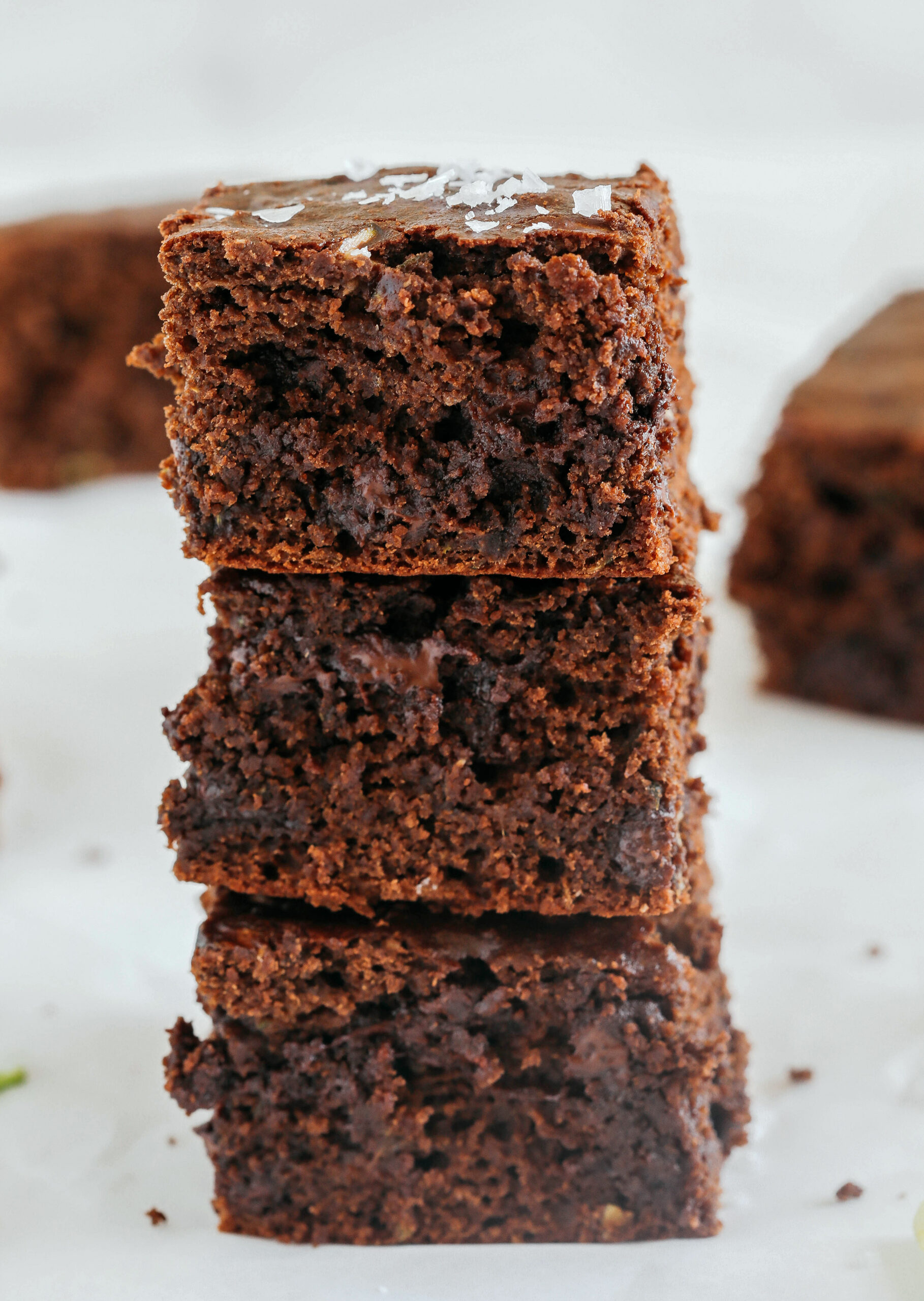 These Fudgy Zucchini Brownies are deliciously moist with a rich chocolate taste loaded with shredded zucchini and made healthier with zero butter or refined sugar!  One of our family's favorite summer desserts!