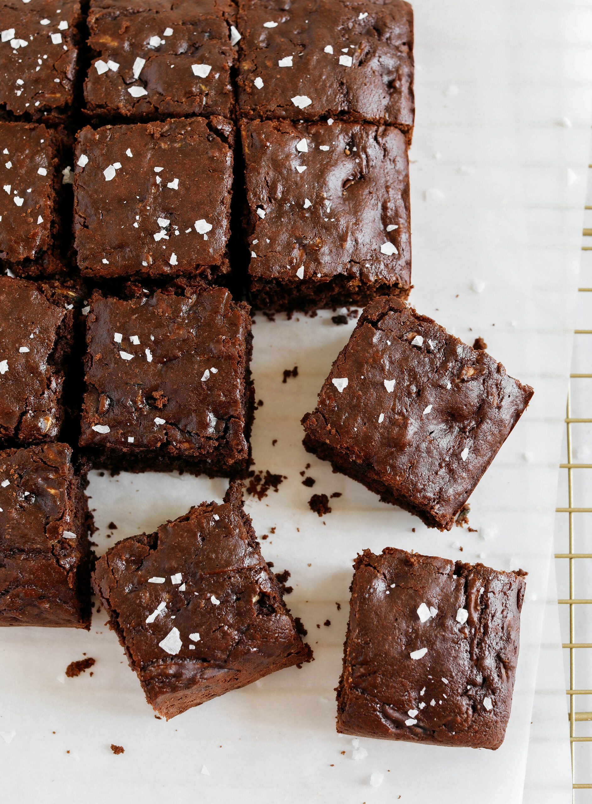 These Fudgy Zucchini Brownies are deliciously moist with a rich chocolate taste loaded with shredded zucchini and made healthier with zero butter or refined sugar!  One of our family's favorite summer desserts!