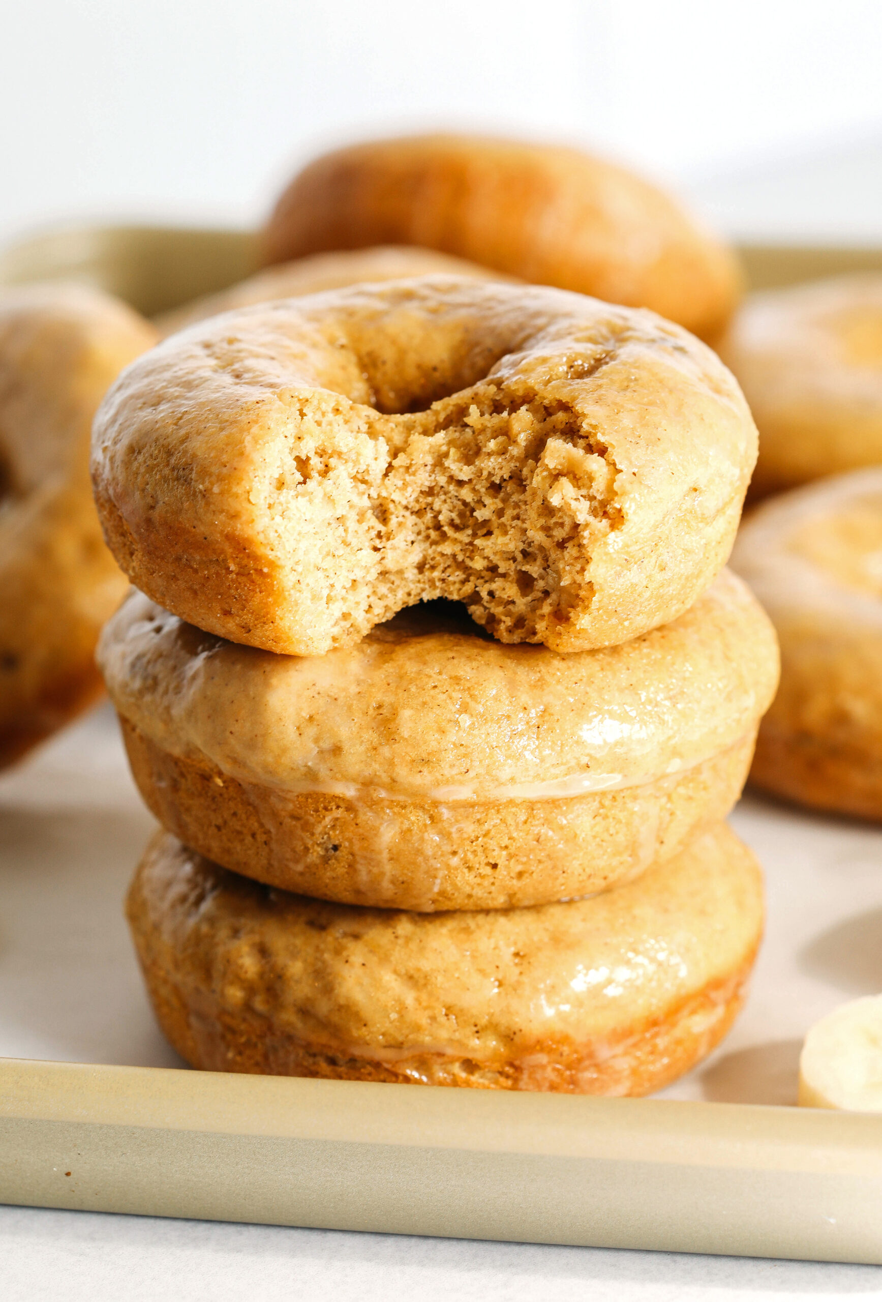 These Baked Banana Bread Donuts are soft, cake-like and made healthier with whole wheat flour, applesauce and zero refined sugar for the perfect morning treat that comes together in just 20 minutes!  Such a great way to use up those overripe bananas!