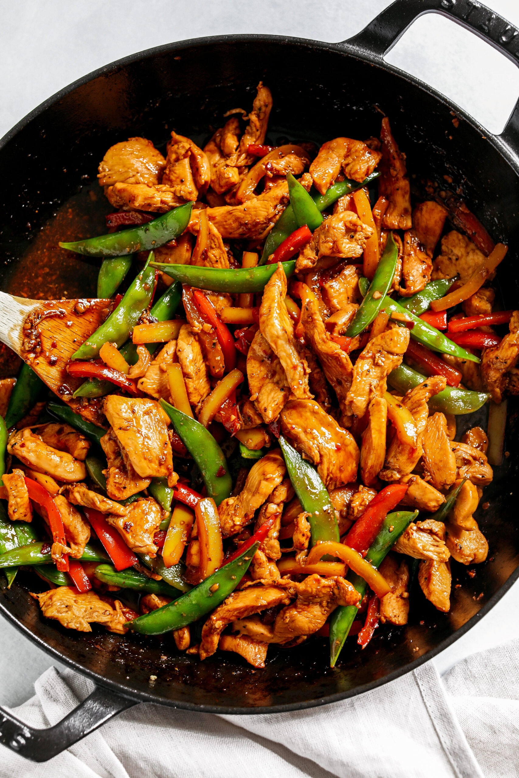 This sweet and spicy Firecracker Chicken Stir Fry is the perfect weeknight meal with tender, juicy chicken, crisp vegetables, all smothered in a delicious sauce that tastes way better than take-out!  Serve over rice and have dinner on your table in under 30 minutes! 