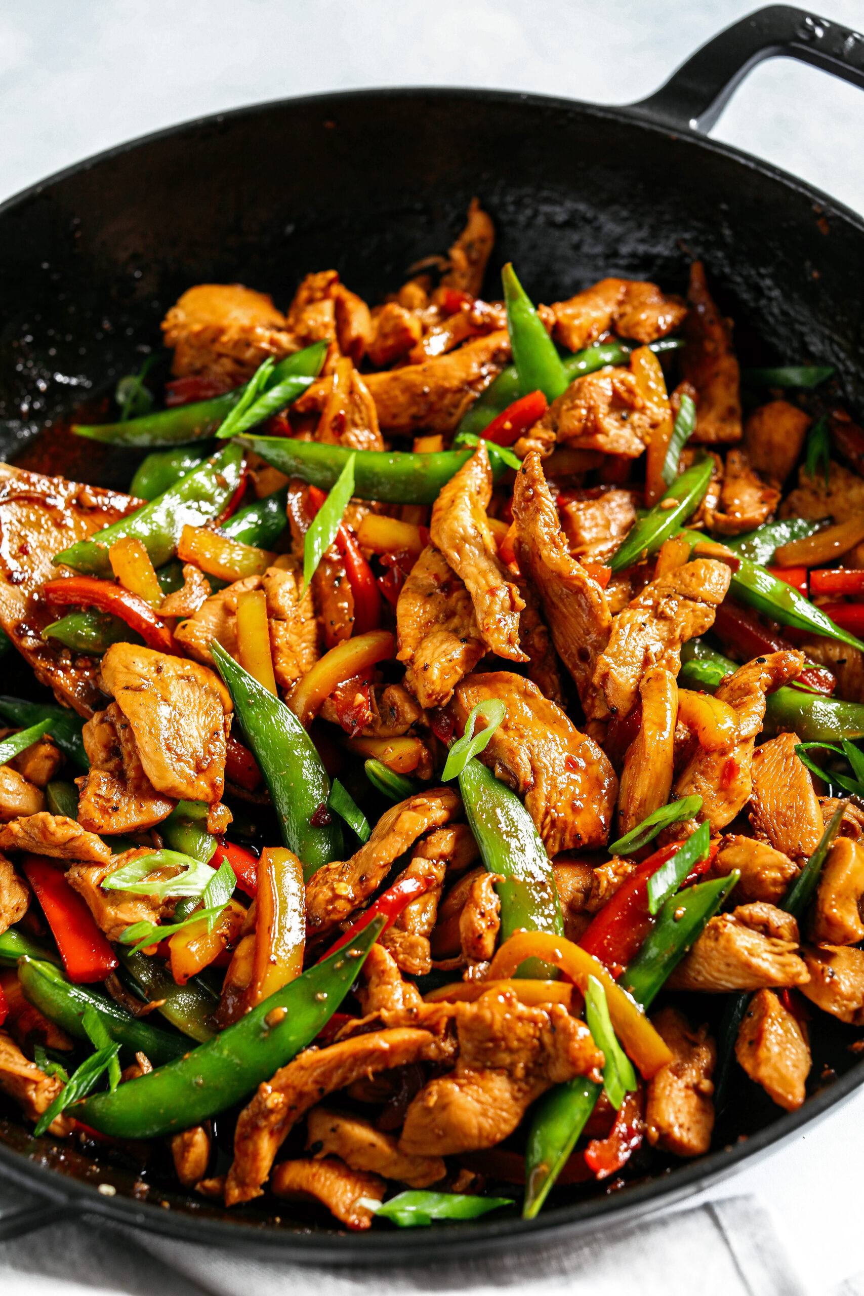 This sweet and spicy Firecracker Chicken Stir Fry is the perfect weeknight meal with tender, juicy chicken, crisp vegetables, all smothered in a delicious sauce that tastes way better than take-out!  Serve over rice and have dinner on your table in under 30 minutes! 