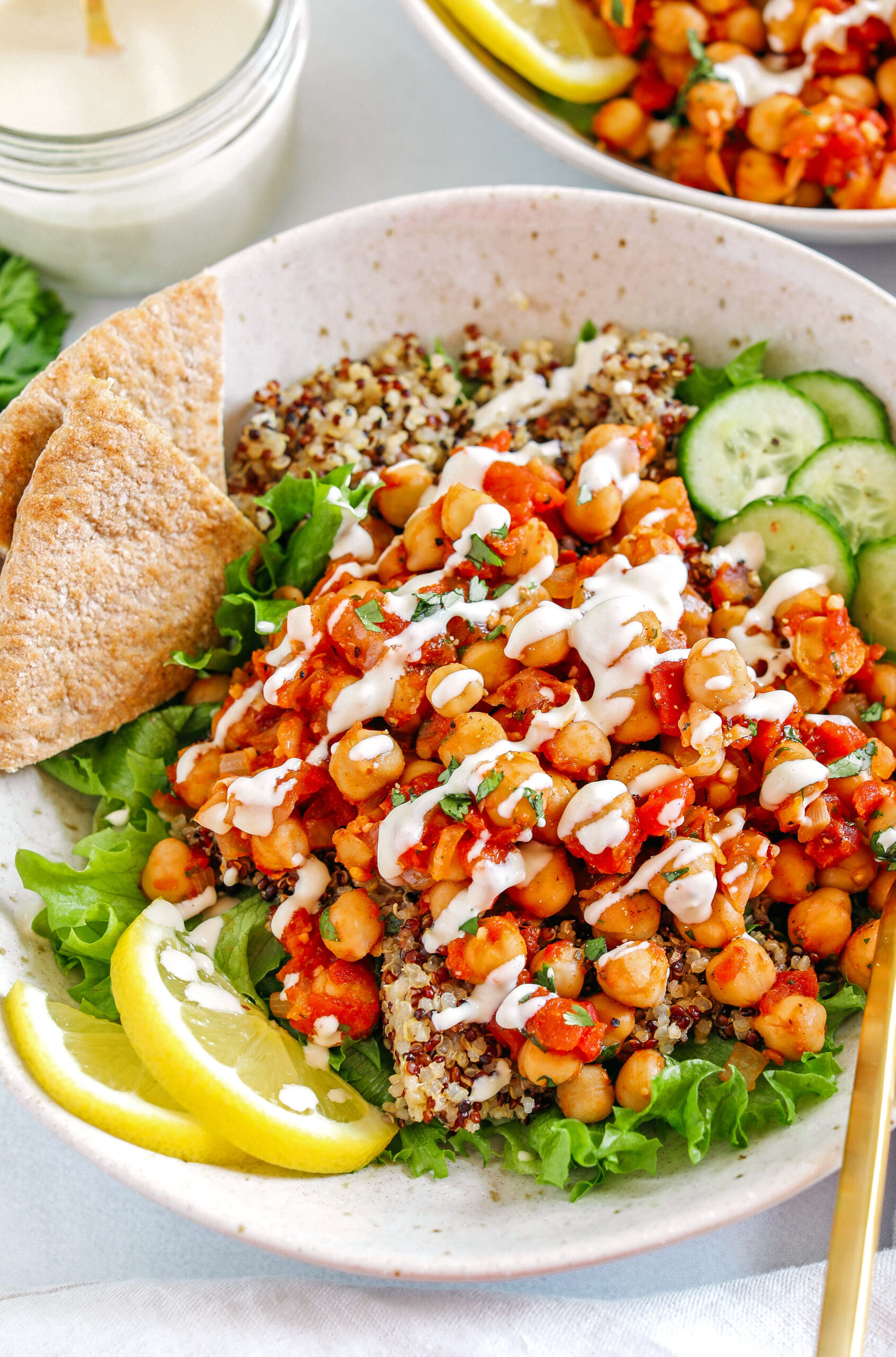 Protein-packed Spicy Chickpea Quinoa Bowls are loaded with flavor, perfect for meal prep and are easily made in just 20 minutes!  Drizzle my lemony tahini dressing over top for even more flavor!