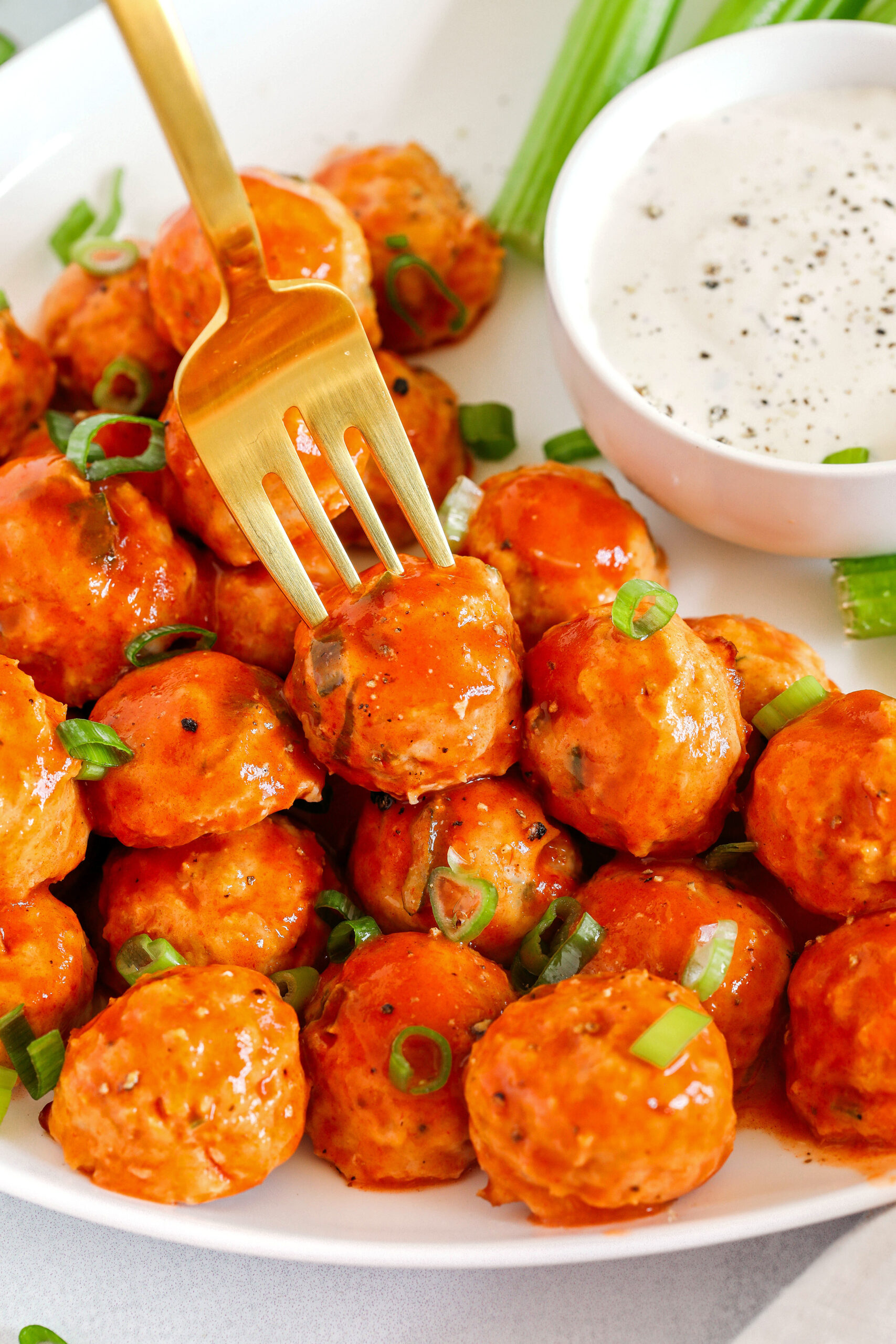 These Buffalo Chicken Meatballs make the perfect party appetizer, game day snack or healthy weeknight dinner!  Easily made with just a few simple ingredients for delicious flavor-packed meatballs served with fresh veggies and your favorite dipping sauce!