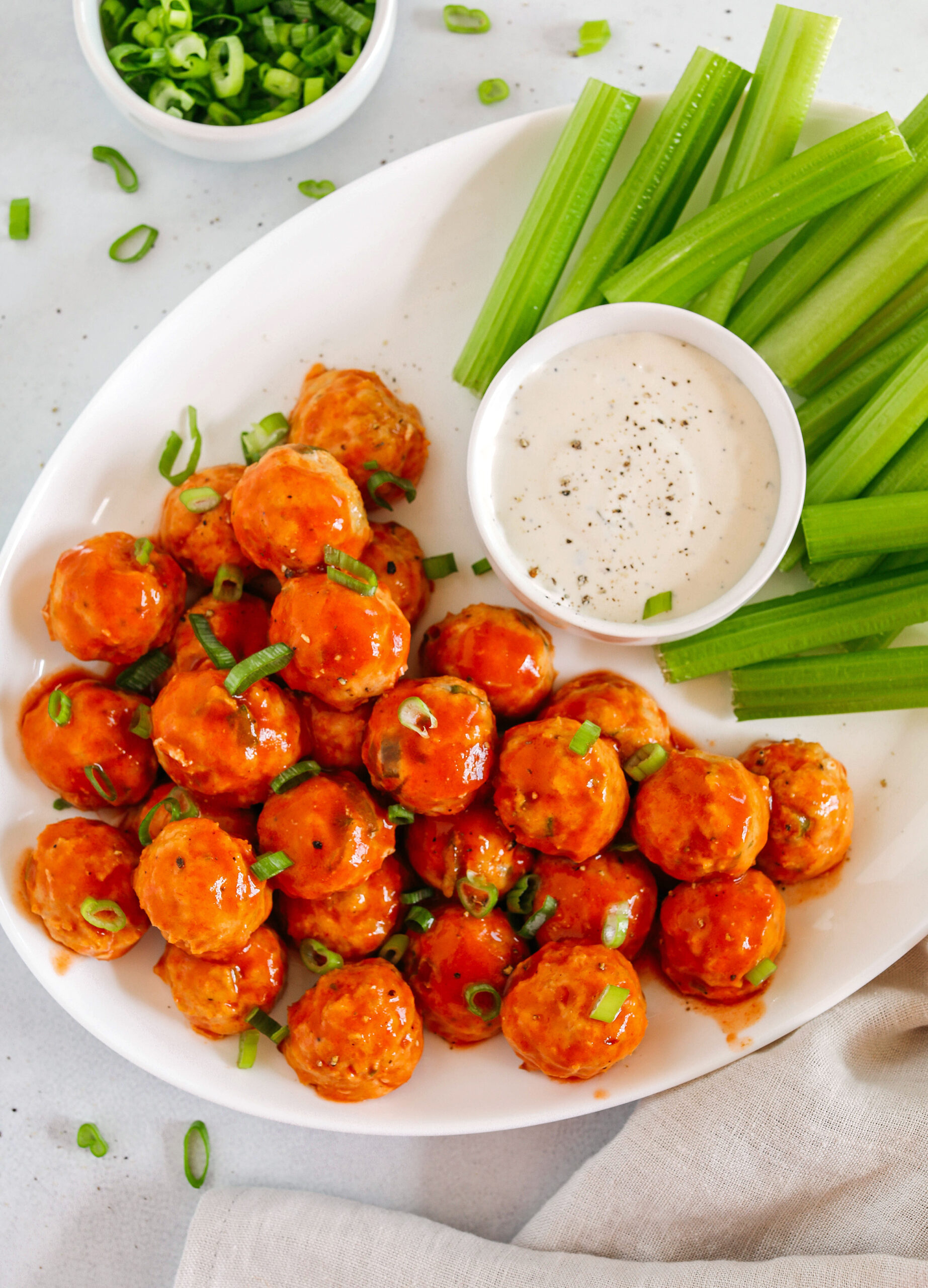 These Buffalo Chicken Meatballs make the perfect party appetizer, game day snack or healthy weeknight dinner!  Easily made with just a few simple ingredients for delicious flavor-packed meatballs served with fresh veggies and your favorite dipping sauce!