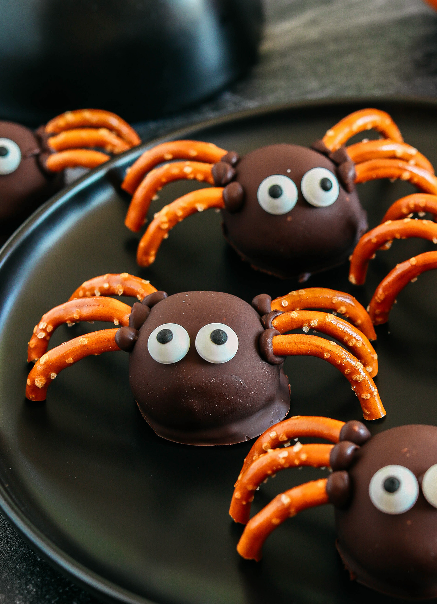 Get festive this Halloween with these tasty Chocolate Peanut Butter Spider Balls made with just 5 simple ingredients and zero baking required!  The perfect sweet and salty treats that are easy to make and your kids will love!