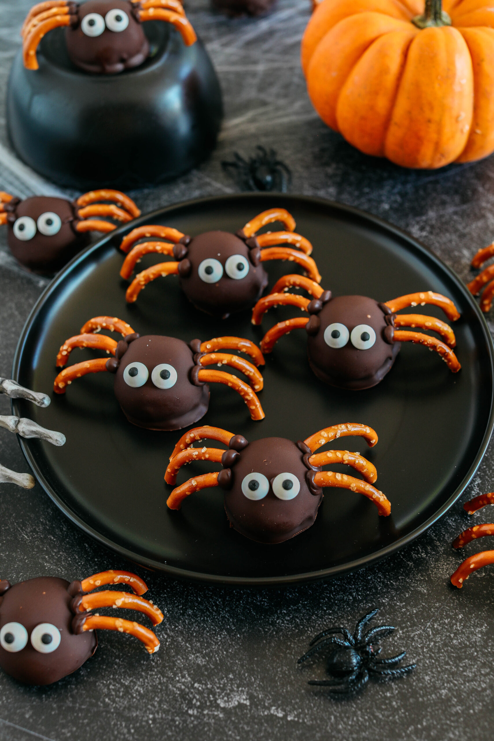 Get festive this Halloween with these tasty Chocolate Peanut Butter Spider Balls made with just 5 simple ingredients and zero baking required!  The perfect sweet and salty treats that are easy to make and your kids will love!