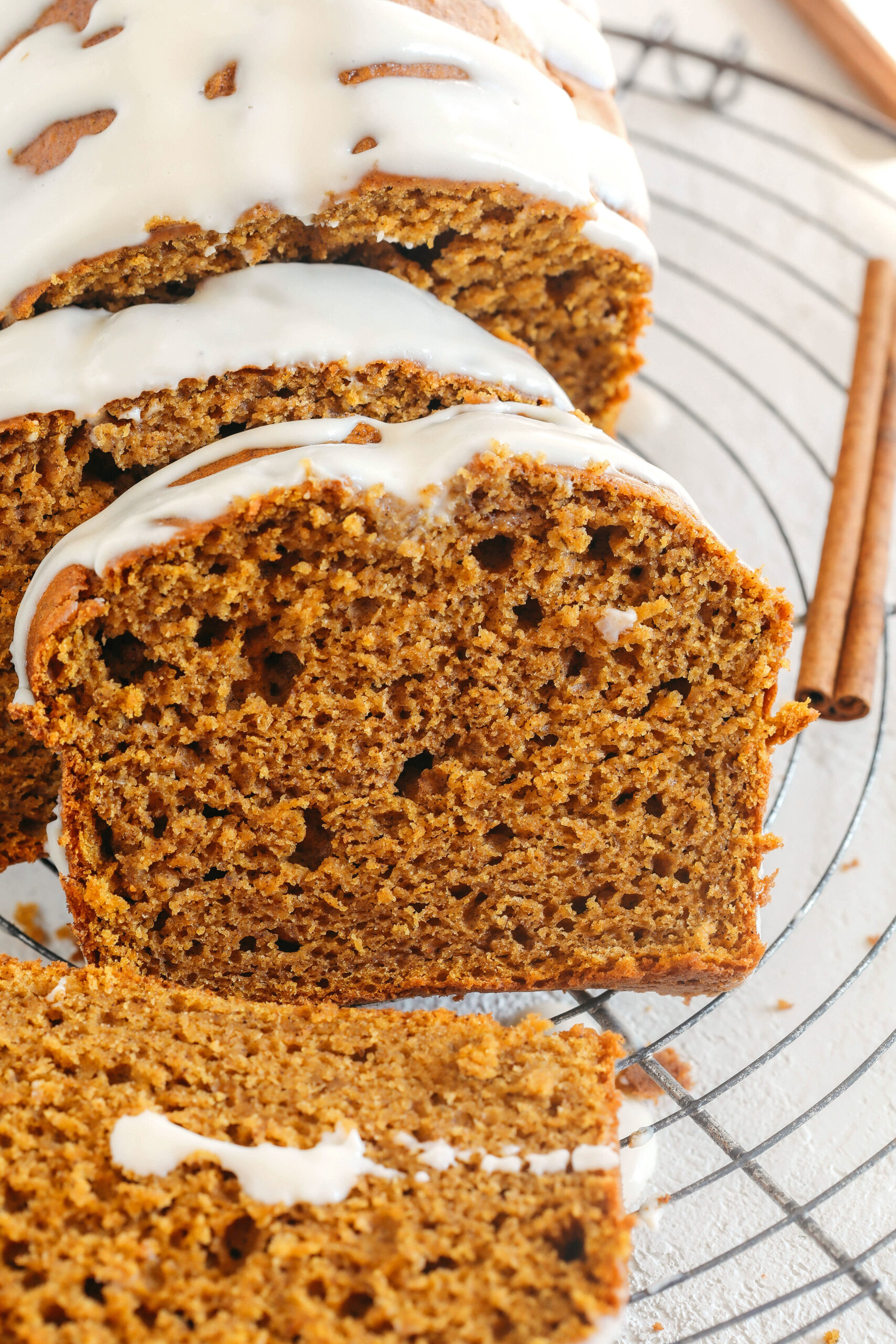 The BEST Healthy Pumpkin Bread recipe that is moist, loaded with pumpkin flavor and made without any butter or refined sugar!  Topped with a delicious maple cream cheese glaze for the perfect fall treat this season!