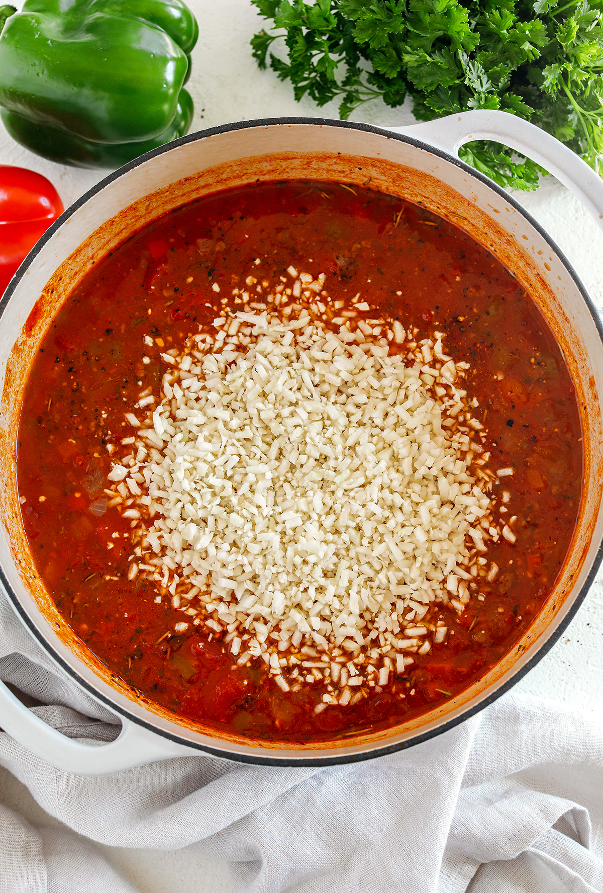 This hearty Stuffed Pepper Soup is loaded with seasoned ground beef, colorful bell peppers, onion and cauliflower rice all simmered in a flavorful broth for a delicious one pot meal the whole family will love!
