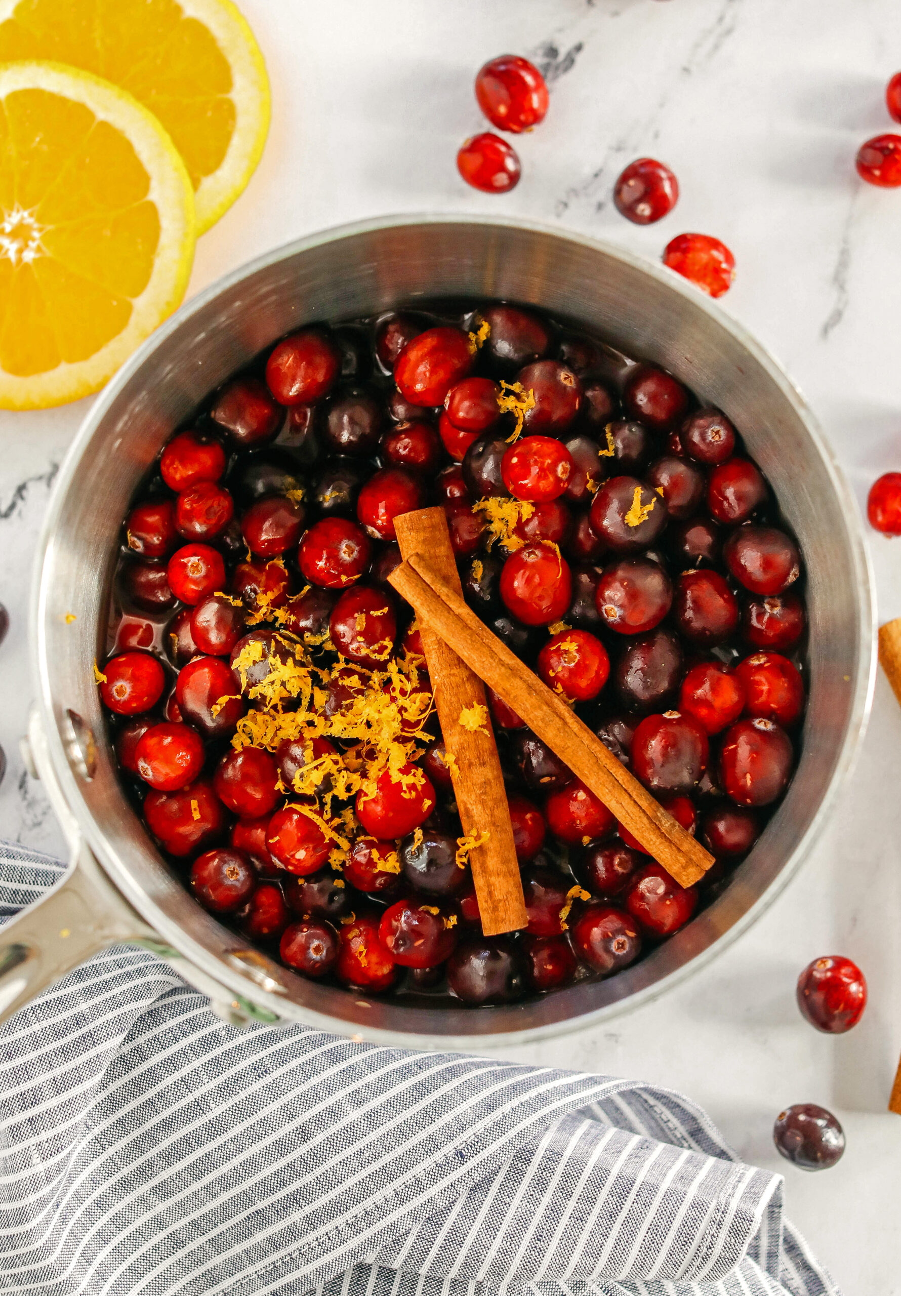 This Healthy Cranberry Sauce is naturally sweetened made with maple syrup, fresh orange juice, cinnamon, ginger and deep rich flavors from a little port wine.  Sweet, tangy and the perfect addition to your Thanksgiving and Christmas table this season!