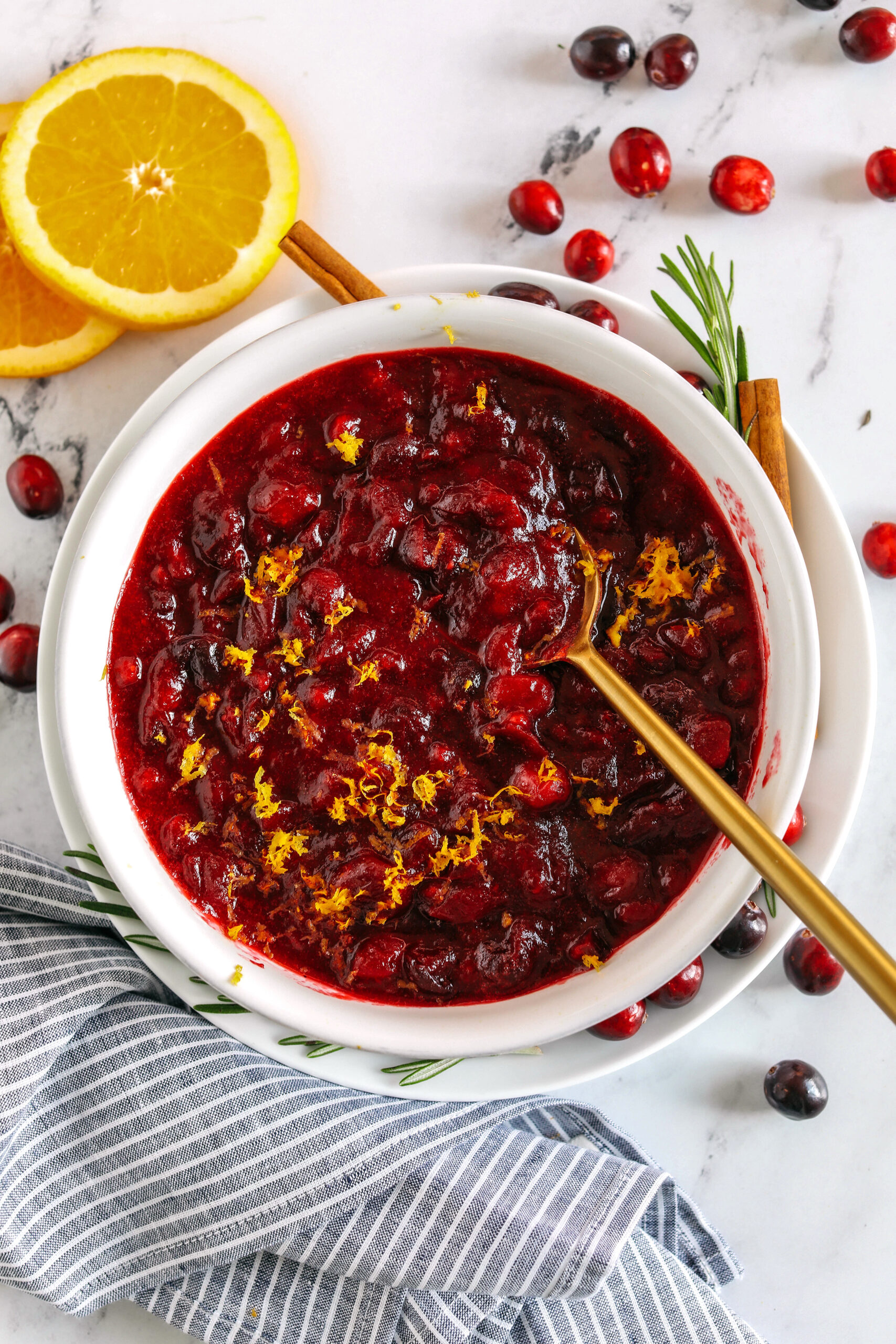 This Healthy Cranberry Sauce is naturally sweetened made with maple syrup, fresh orange juice, cinnamon, ginger and deep rich flavors from a little port wine.  Sweet, tangy and the perfect addition to your Thanksgiving and Christmas table this season!