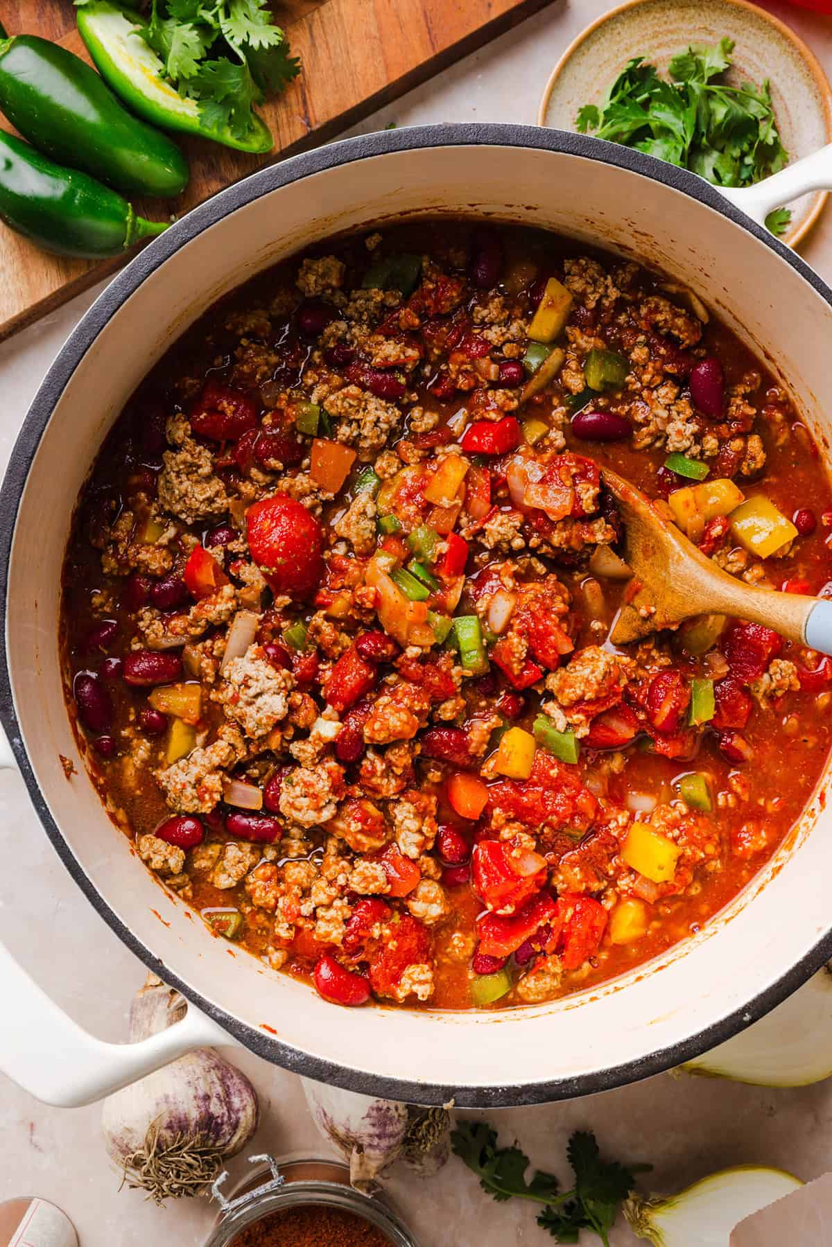 Homemade turkey chili simmering in a large pot.