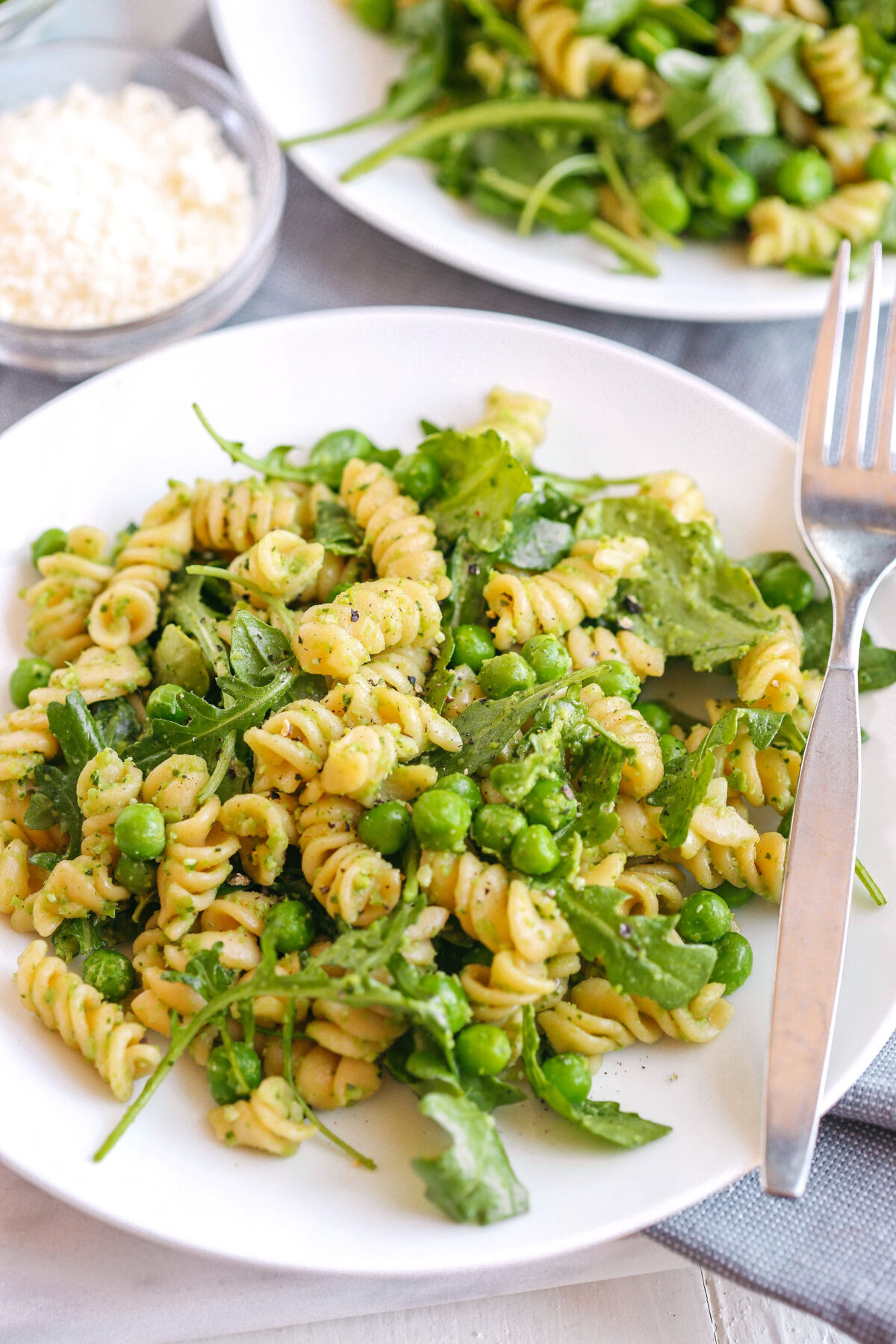 This light and fresh Pea and Arugula Pesto Pasta Salad is the perfect meal or side dish that is easy to make, healthy and delicious!