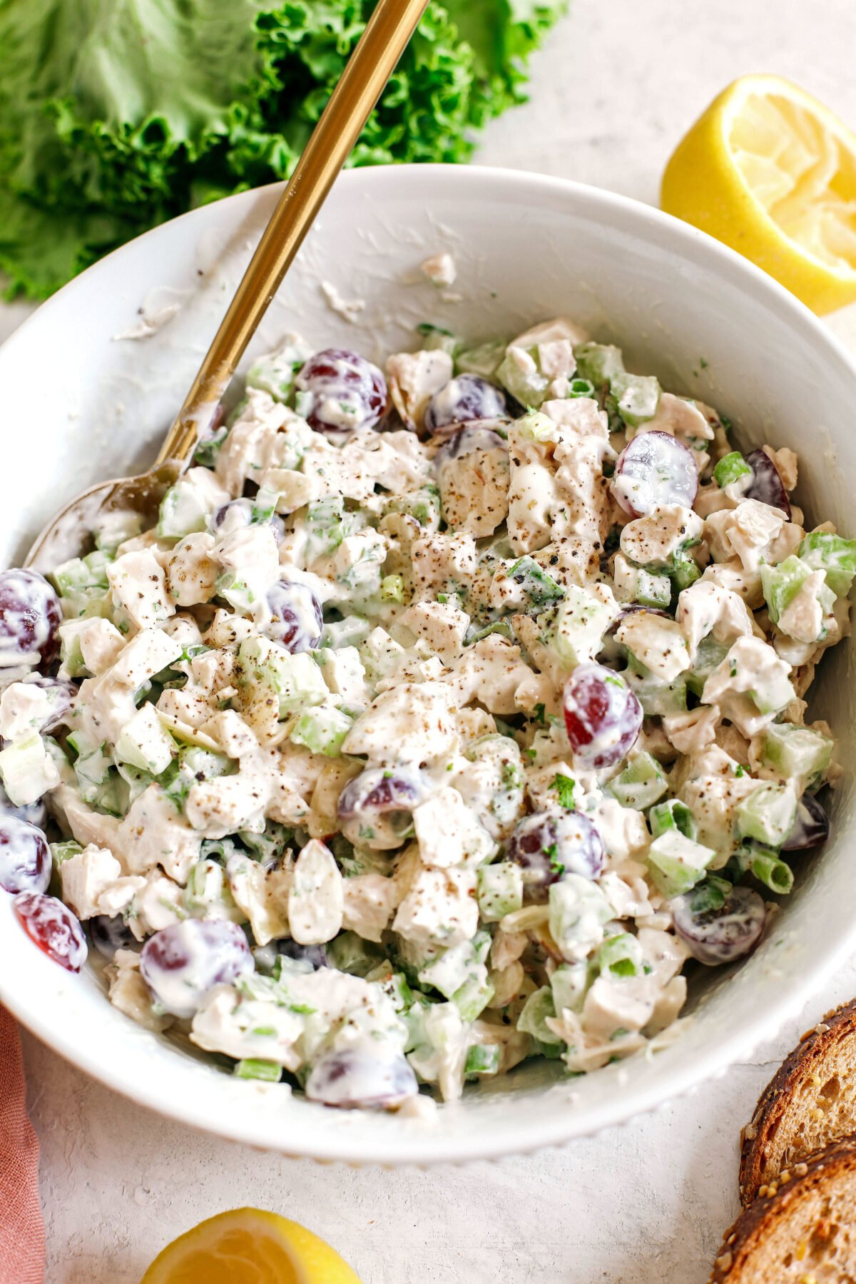 Healthy Chicken Salad made with tender chicken, Greek yogurt instead of mayo, crunchy celery, grapes, and sliced almonds for a delicious spin on a classic favorite!