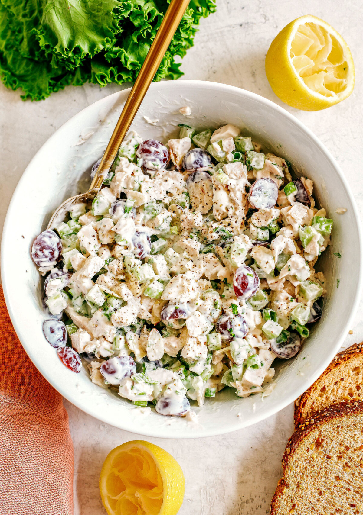 Healthy Chicken Salad made with tender chicken, Greek yogurt instead of mayo, crunchy celery, grapes, and sliced almonds for a delicious spin on a classic favorite!