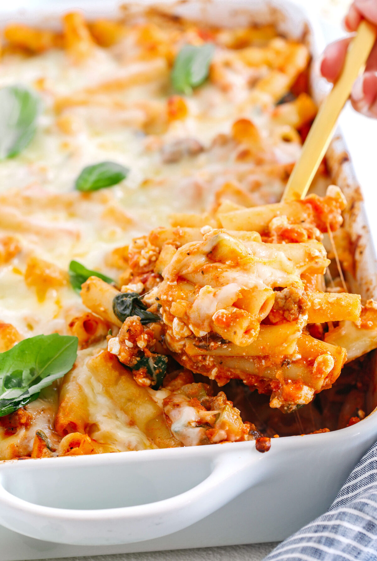 Comforting and delicious Healthy Baked Ziti packed with veggies, flavorful turkey sausage and makes the perfect weeknight meal the whole family will love!  Leftovers guaranteed!