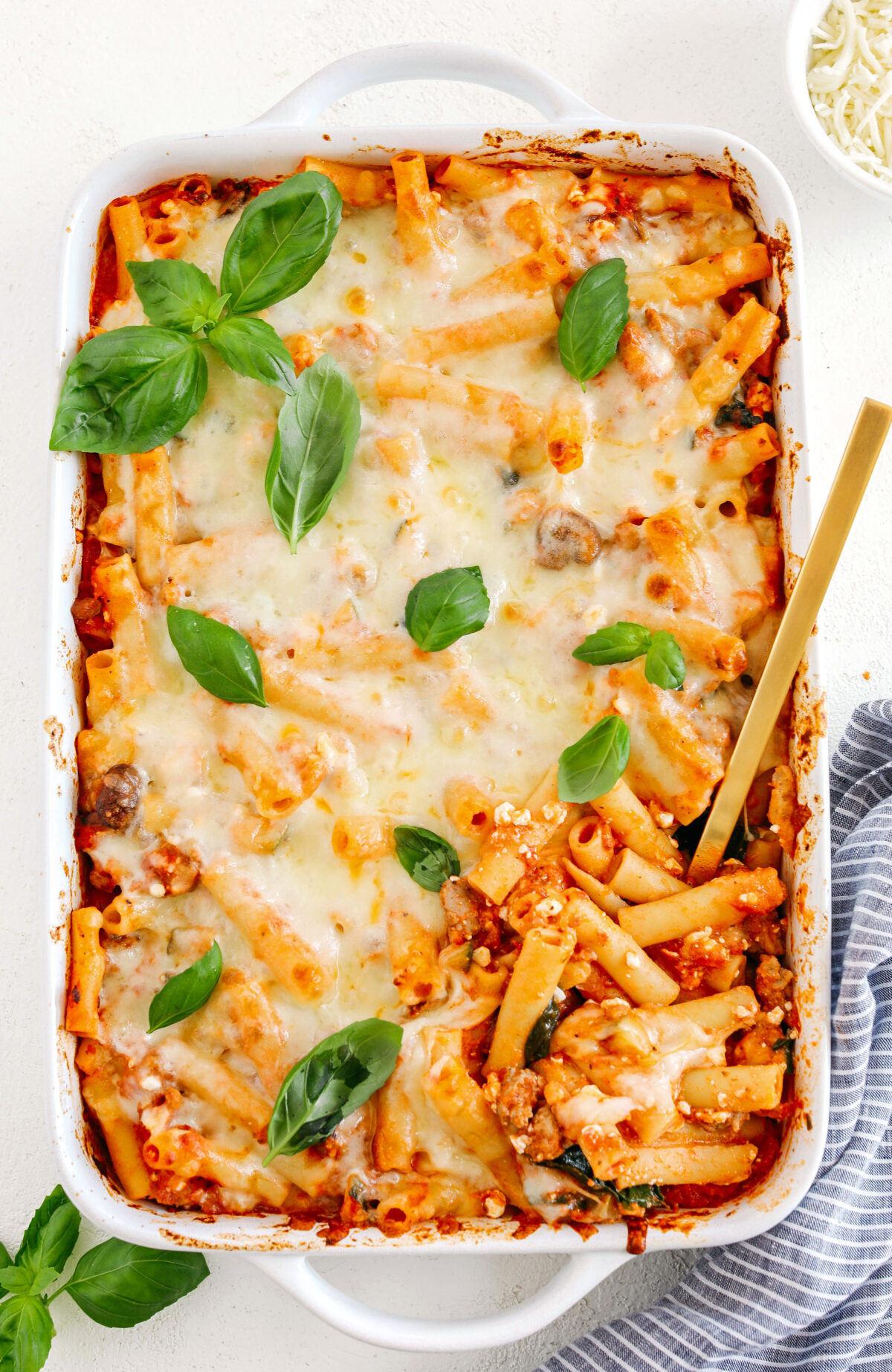 Comforting and delicious Healthy Baked Ziti packed with veggies, flavorful turkey sausage and makes the perfect weeknight meal the whole family will love!  Leftovers guaranteed!