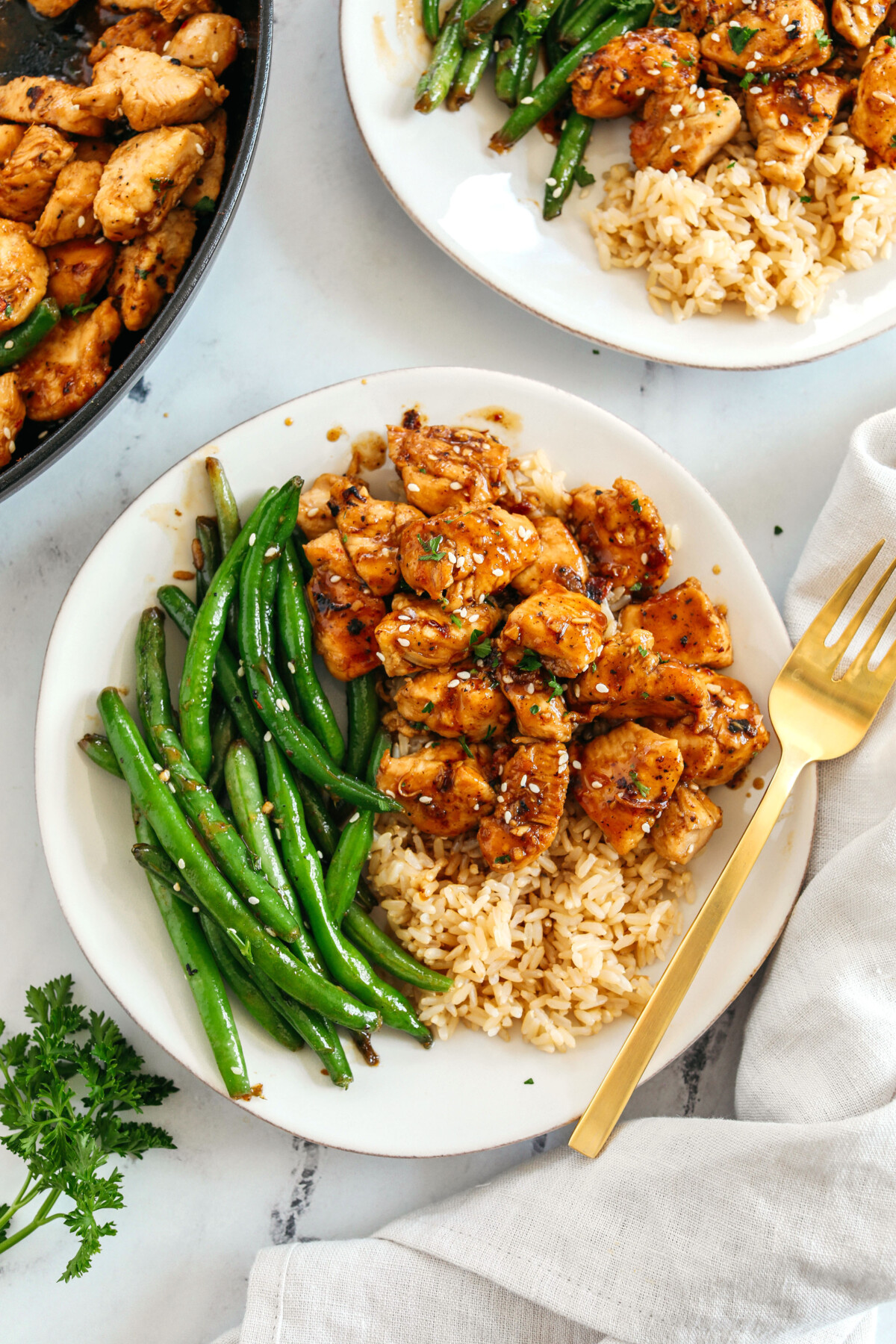 Super flavorful Honey Garlic Chicken and Green Beans make the perfect weeknight meal smothered in a delicious sauce that tastes way better than take-out!  Serve over rice and have dinner on your table in under 30 minutes! 