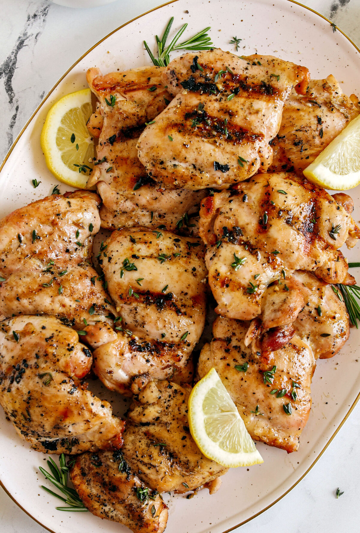 This Lemon Herb Grilled Chicken is easily made with just a few simple ingredients for a delicious, healthy meal!  Packed with so much flavor thanks to tangy lemon juice, tons of garlic, and fresh thyme!