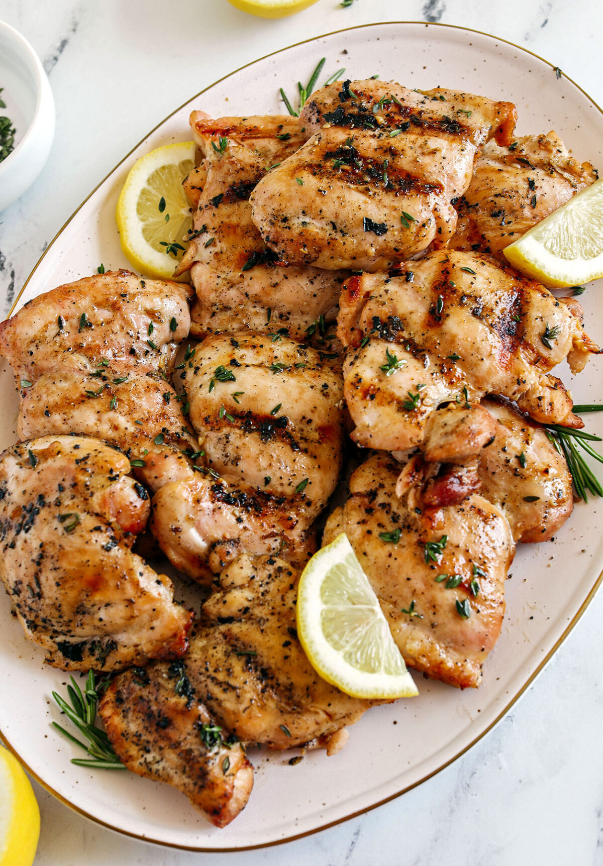 This Lemon Herb Grilled Chicken is easily made with just a few simple ingredients for a delicious, healthy meal!  Packed with so much flavor thanks to tangy lemon juice, tons of garlic, and fresh thyme!