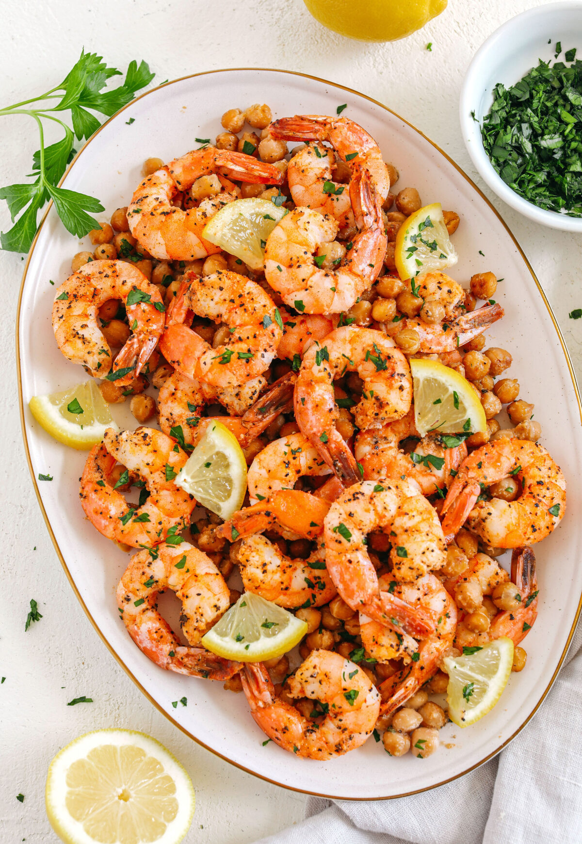 Flavorful Lemon Garlic Shrimp with Chickpeas easily made in under 30 minutes all on one pan with just a few simple ingredients!  Perfect as an appetizer, on top of a salad or even as a main dish!