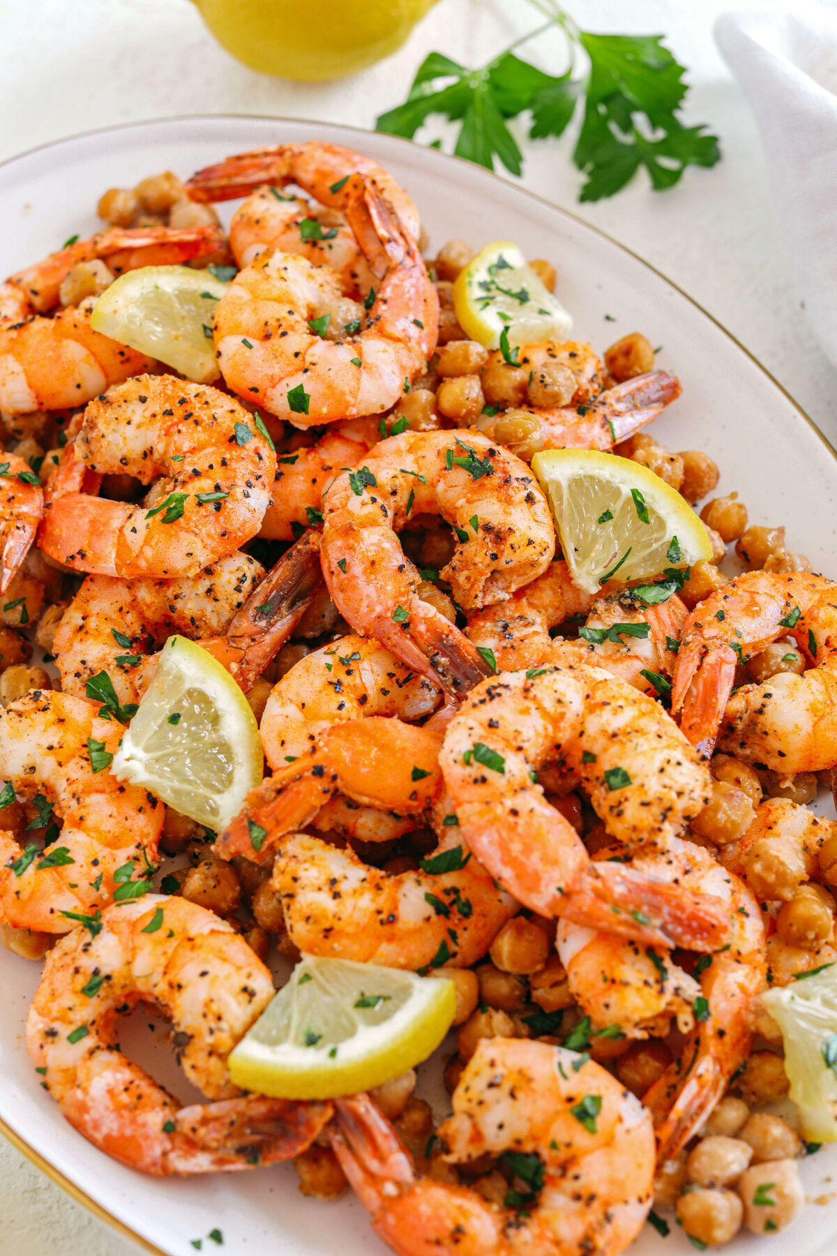 Flavorful Lemon Garlic Shrimp with Chickpeas easily made in under 30 minutes all on one pan with just a few simple ingredients!  Perfect as an appetizer, on top of a salad or even as a main dish!