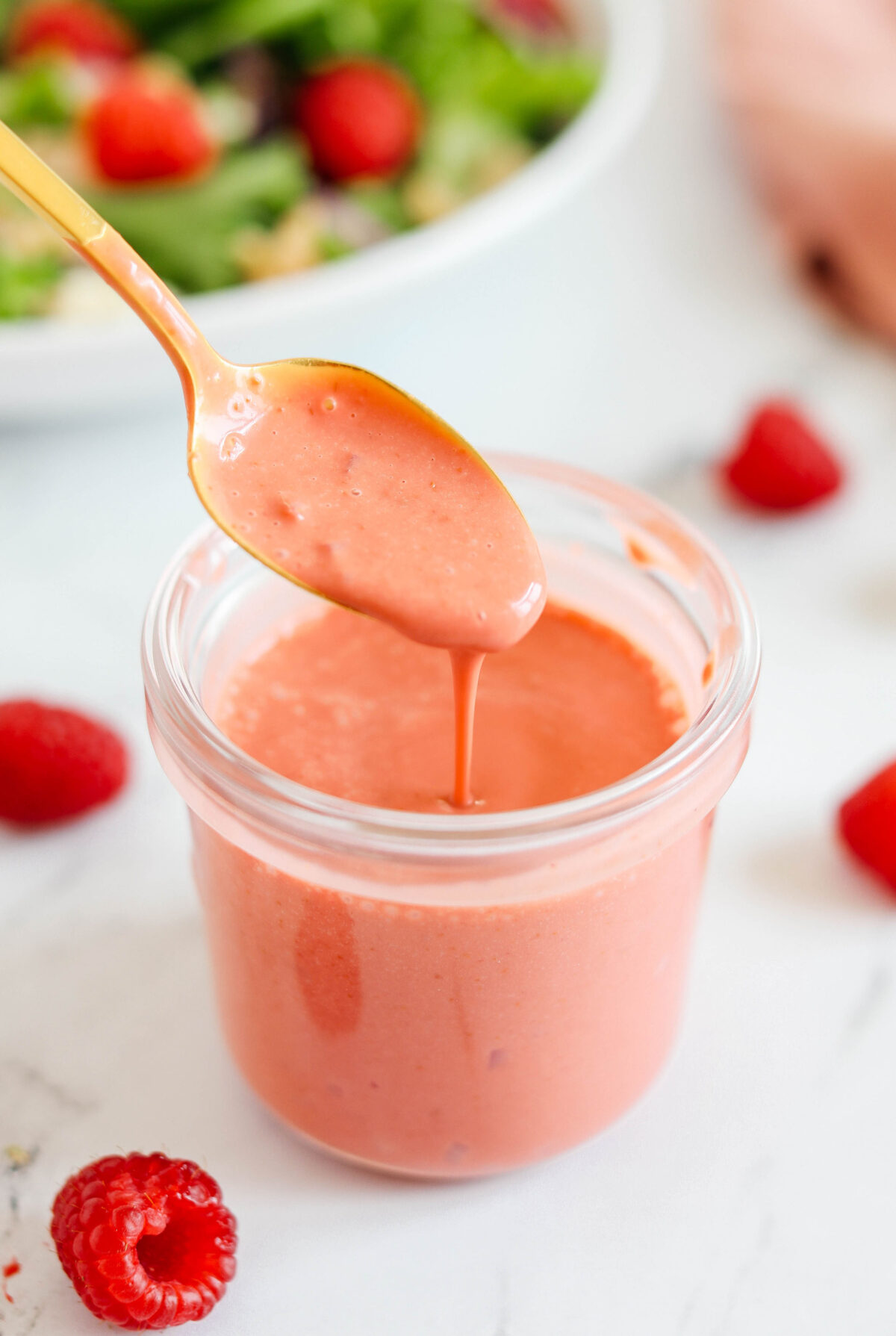 This Easy Raspberry Vinaigrette is a sweet and tangy homemade dressing that comes together in just 5 minutes!  Tastes so much better than store-bought dressings! 